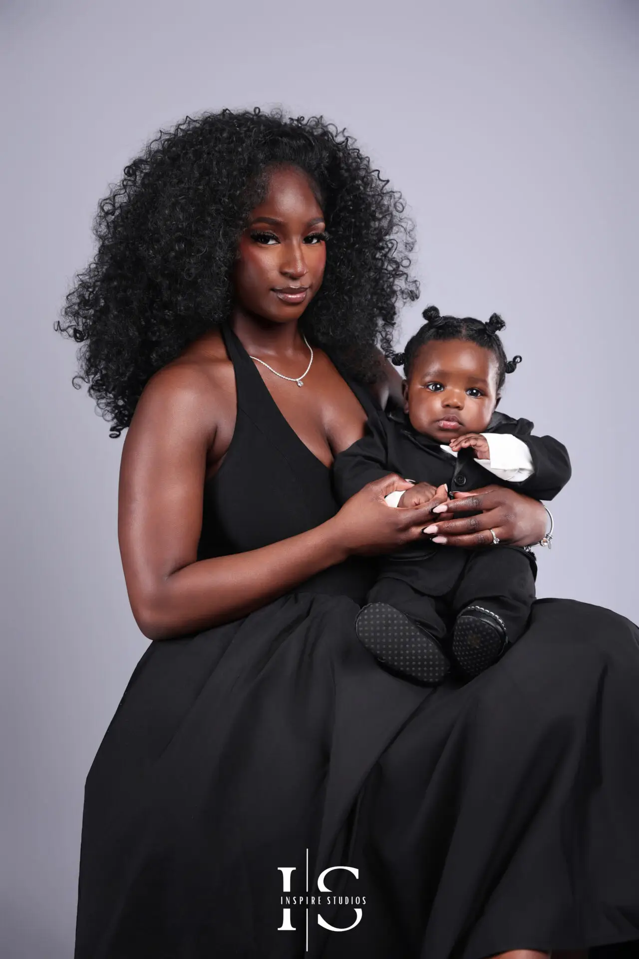 Mother holding her baby during a studio photoshoot