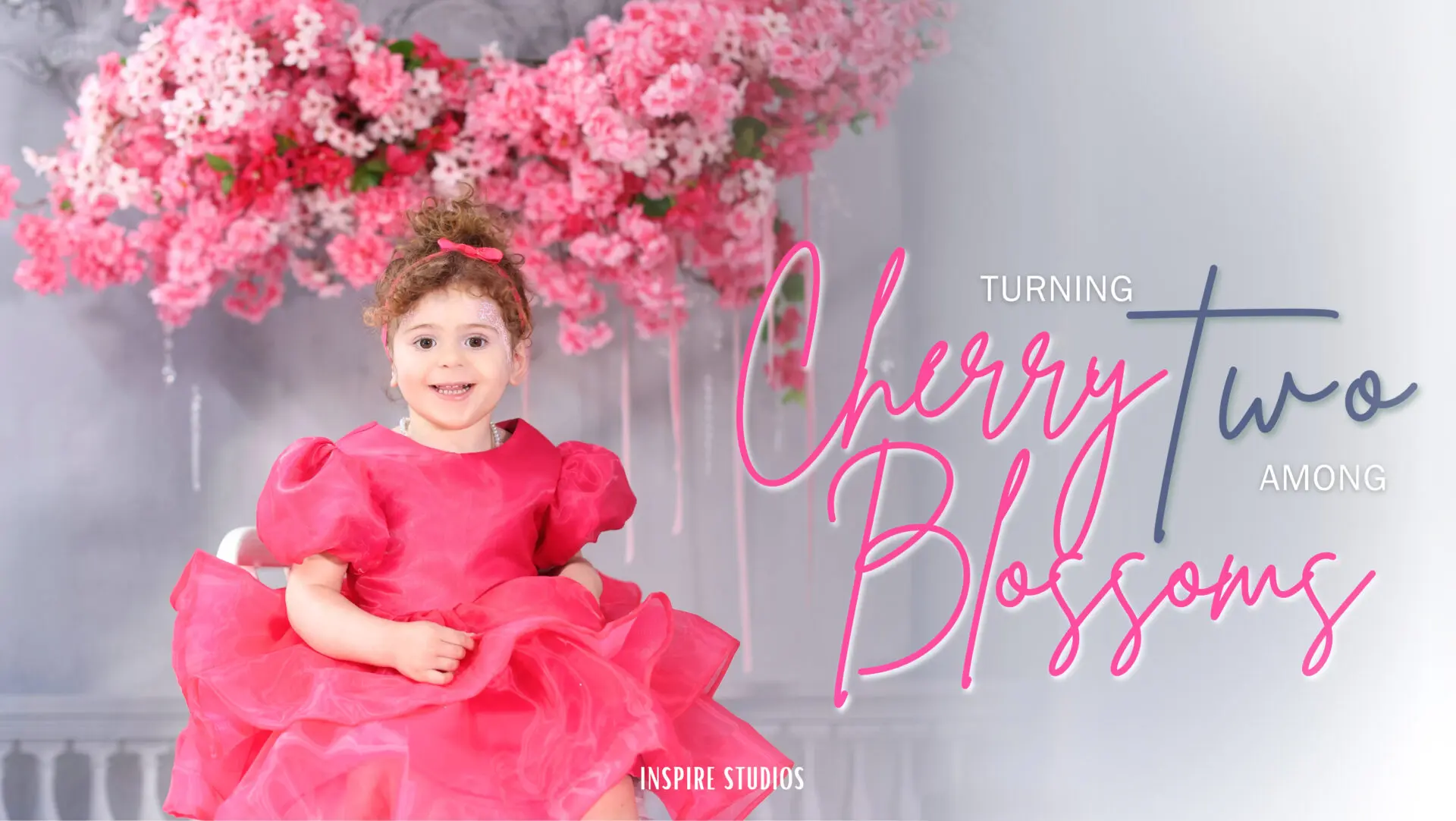 Toddler girl posing during her second birthday studio photoshoot.