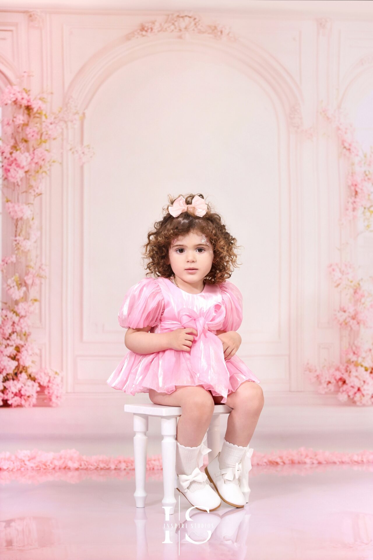 2nd birthday studio photoshoot setup in London featuring floral backdrops and toddler props.