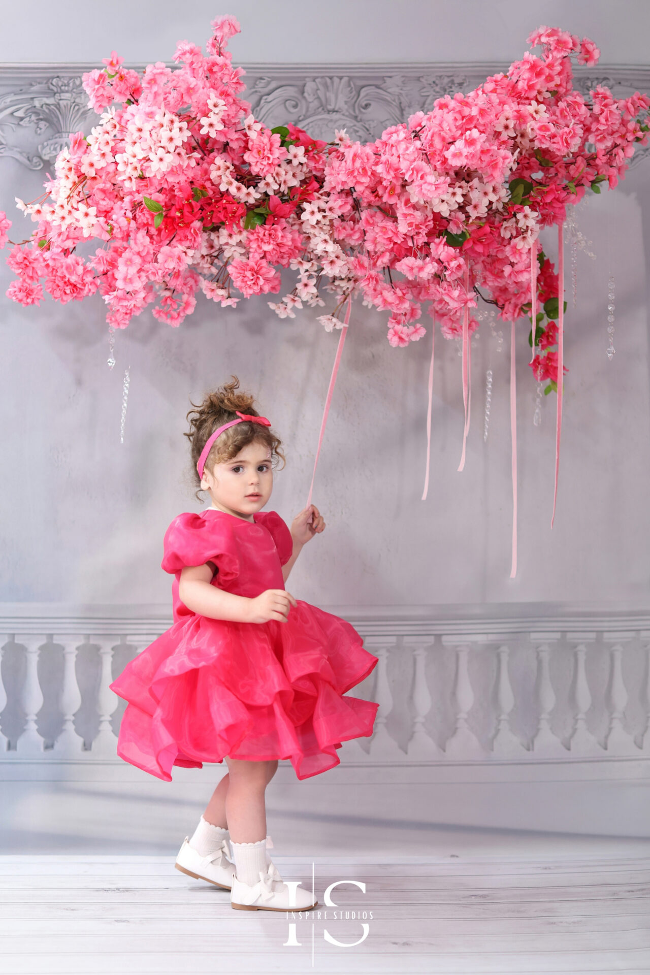 Baby girl dressed for her 2nd birthday studio photo session.