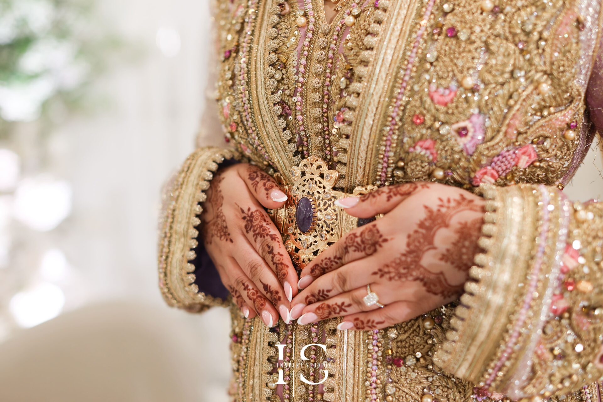 Bride’s veil and henna hands close-up by female wedding photographer