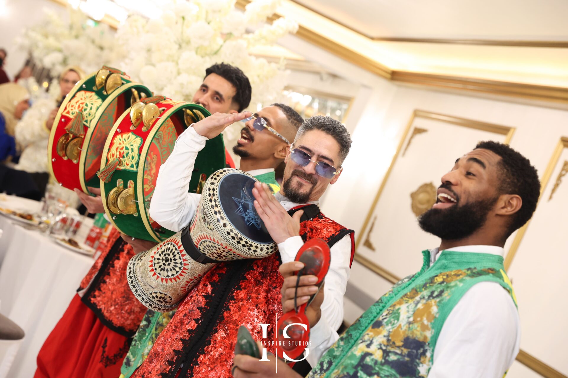 Bride smiling during traditional Moroccan music performance