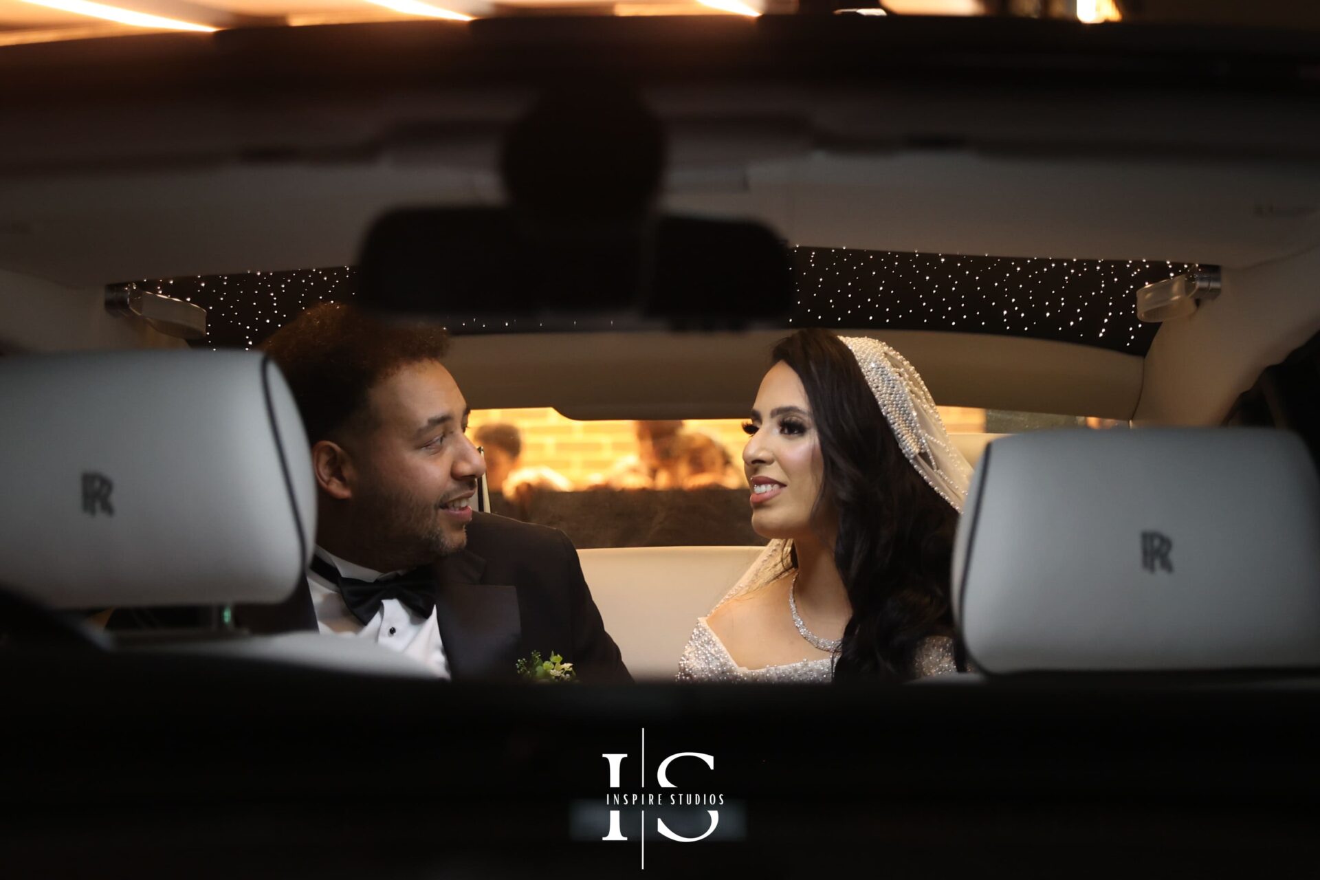 Female wedding photographer with camera at Moroccan ceremony