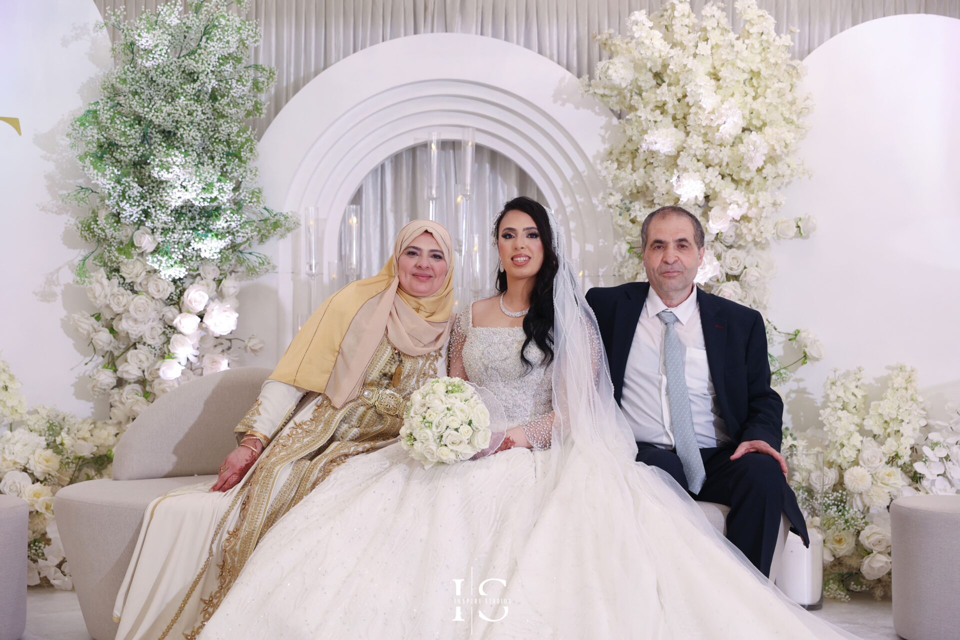 Bride and groom posed by female Moroccan wedding photographer