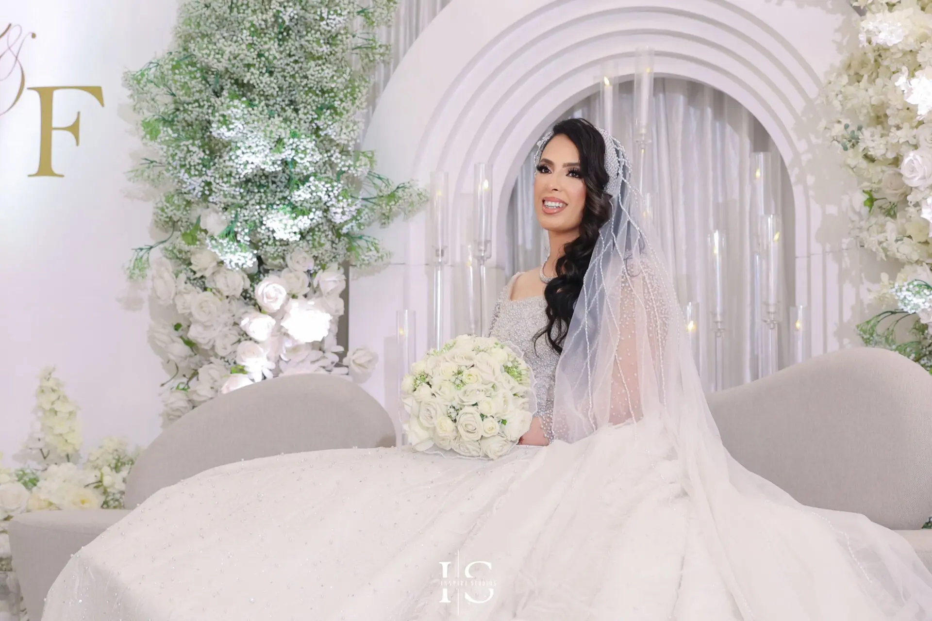 Female wedding photographer capturing bridal prep