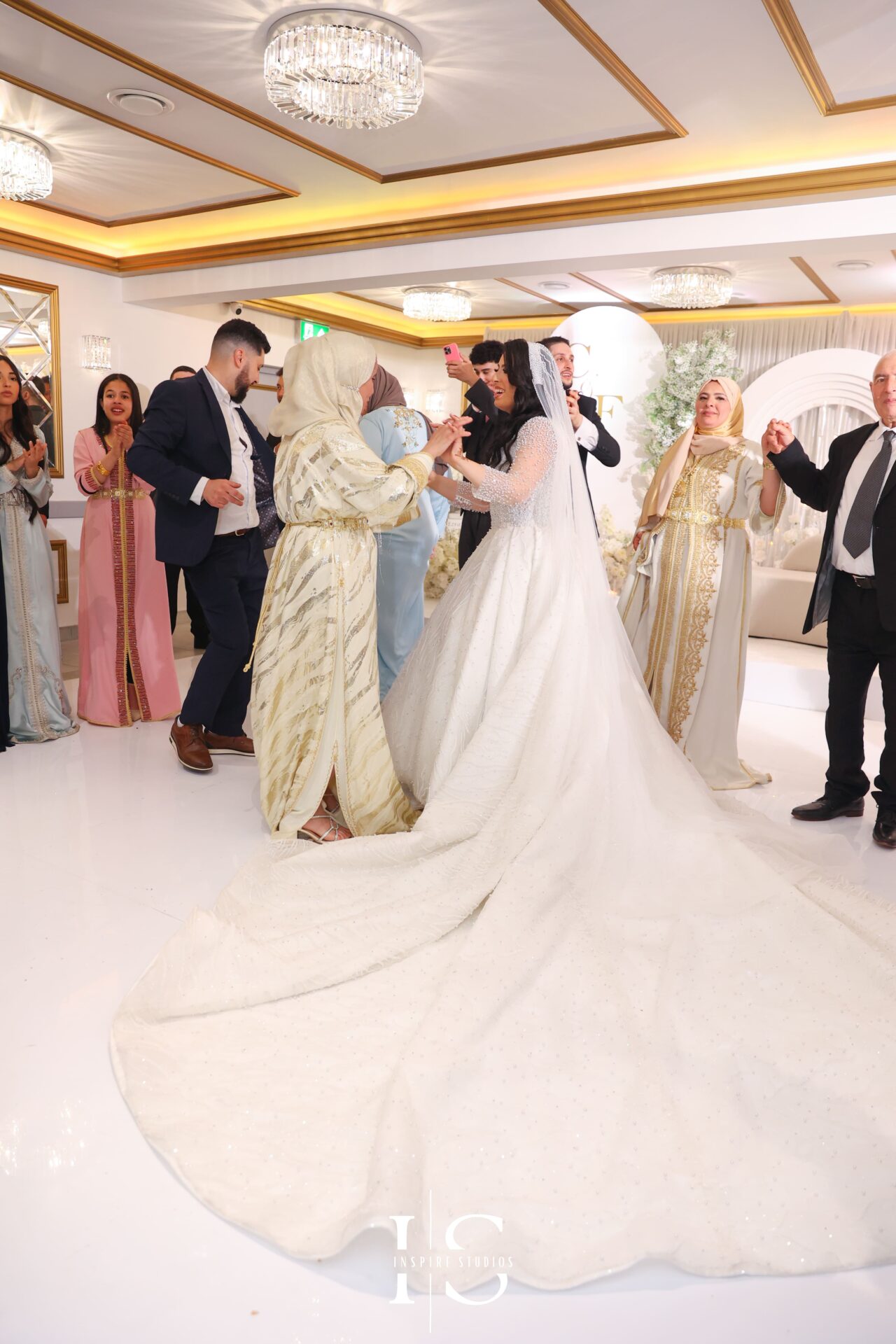 Moroccan mother and bride emotional hug, captured by female photographer