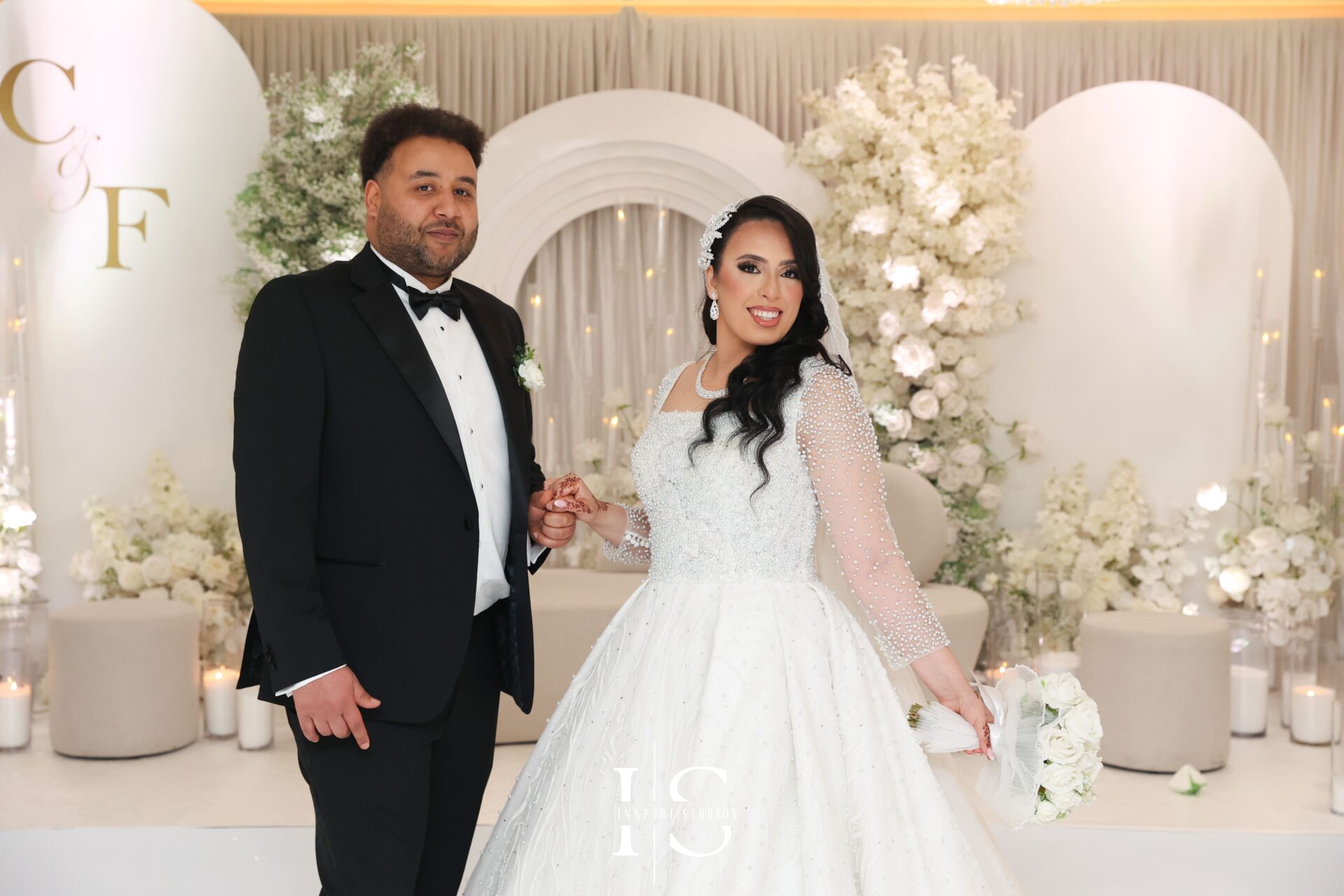 Moroccan wedding stage decor with lanterns and flowers