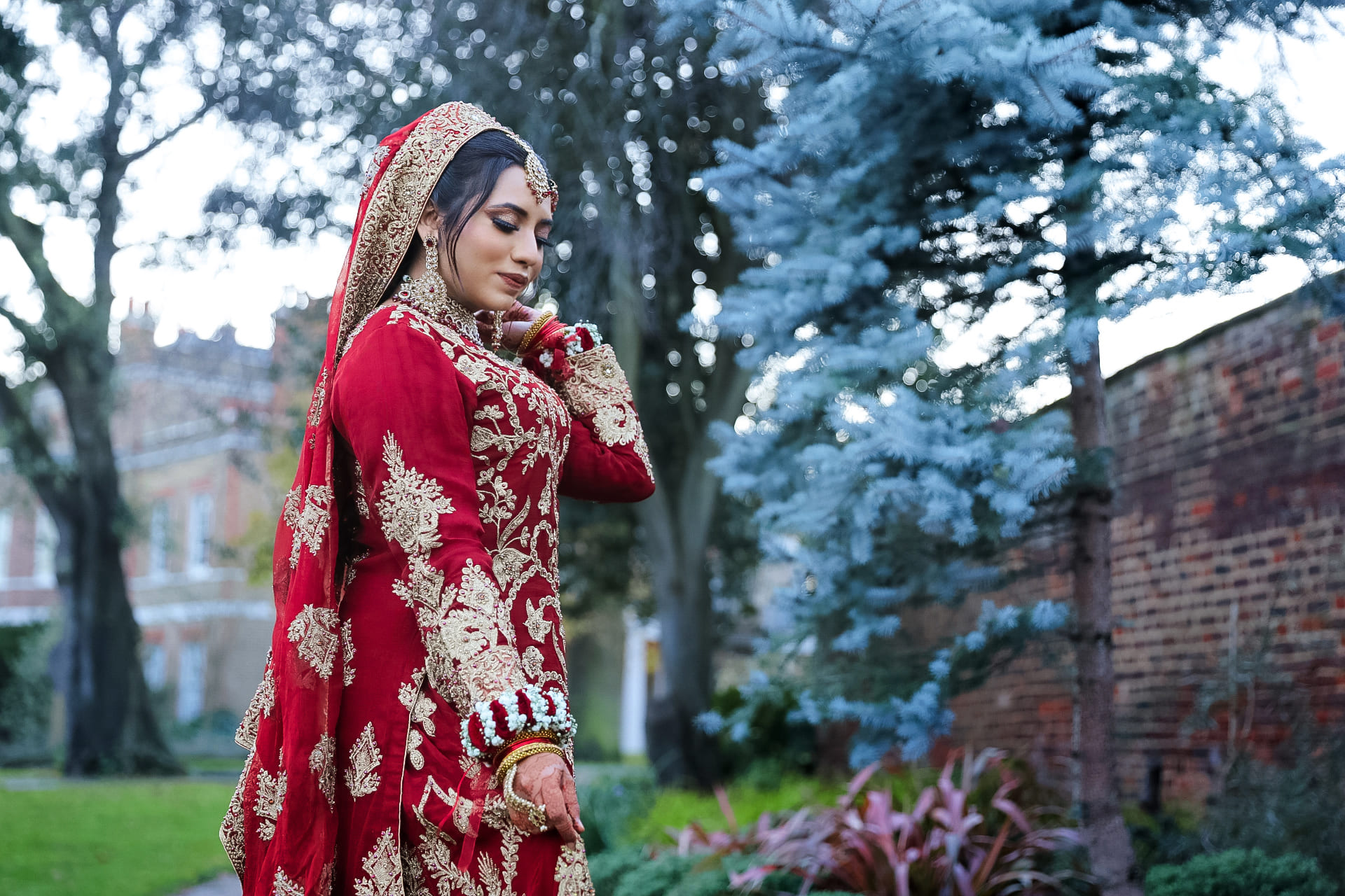 Pakistani Muslim bride smiling in a bridal portrait session in London.