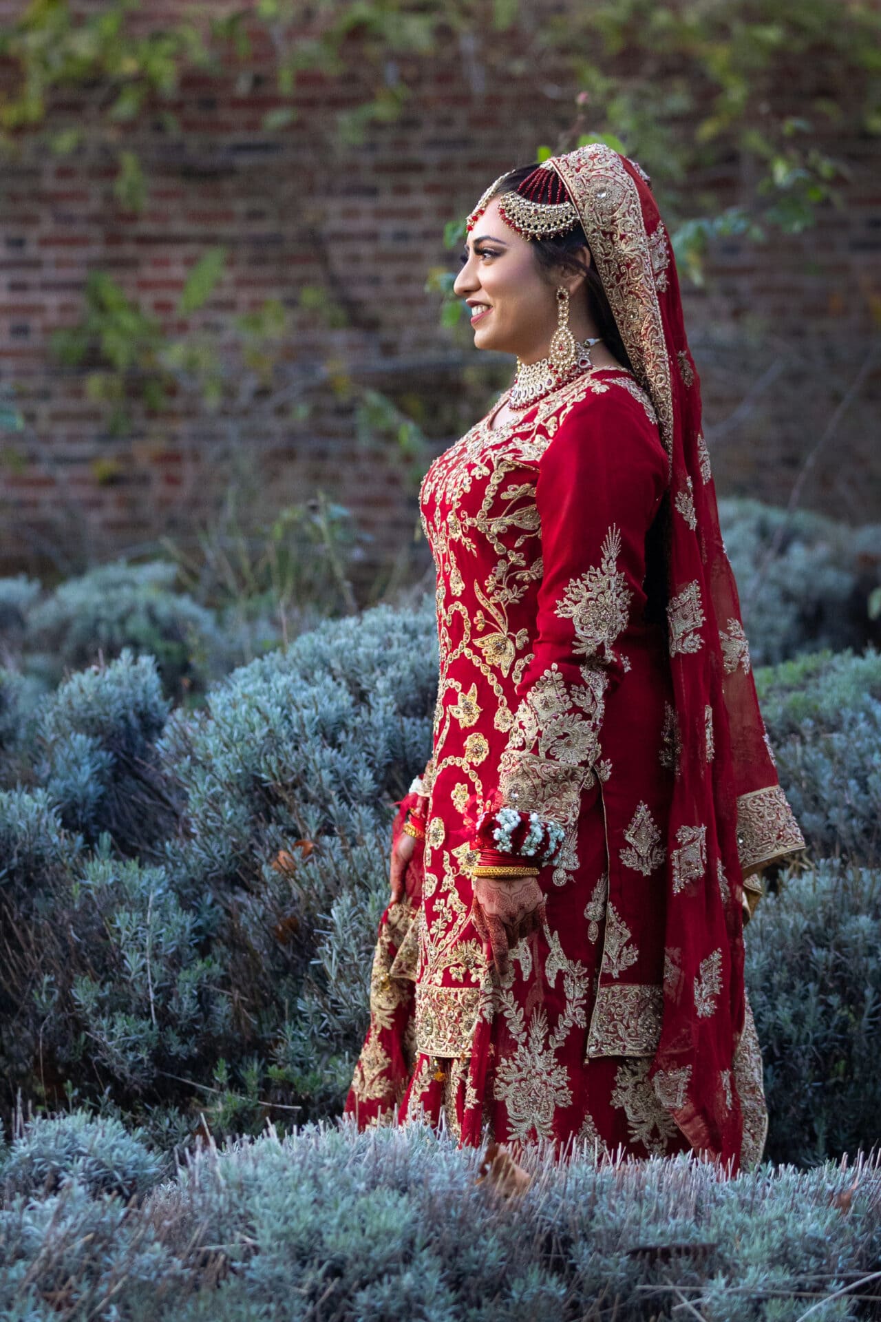 Pakistani couple sharing a moment during an outdoor wedding shoot in London.