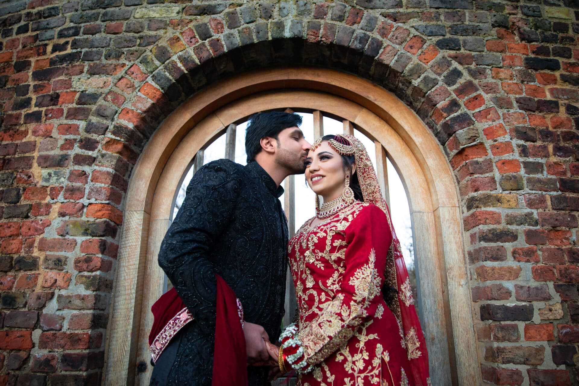 Bride and groom sharing a candid smile during their Muslim wedding shoot in Valentine’s Park