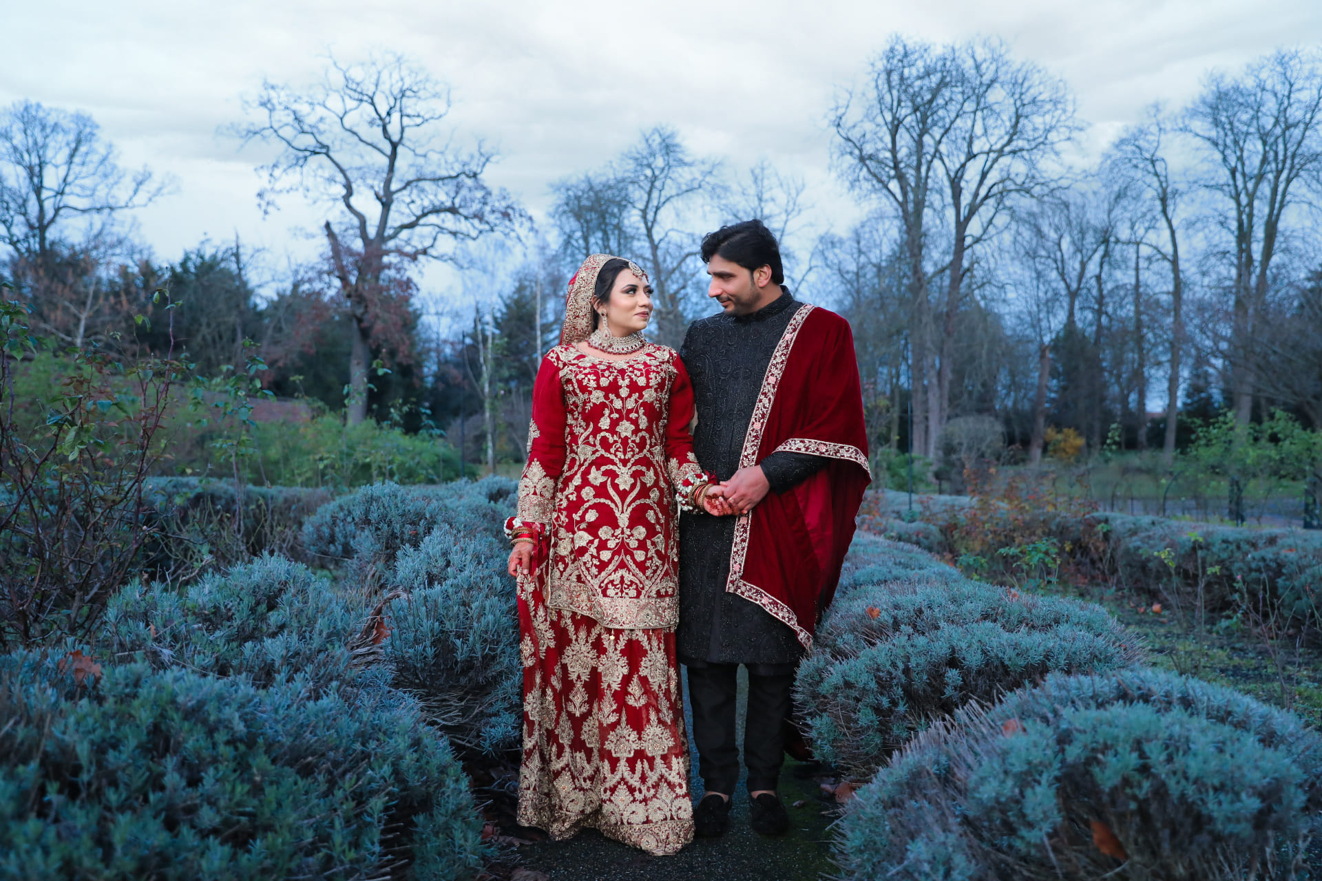 Muslim couple standing together in lavender in Ilford park