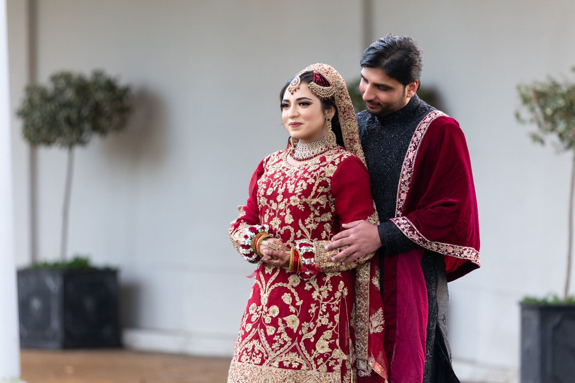 Groom seeing his bride for the first time during Muslim wedding shoot