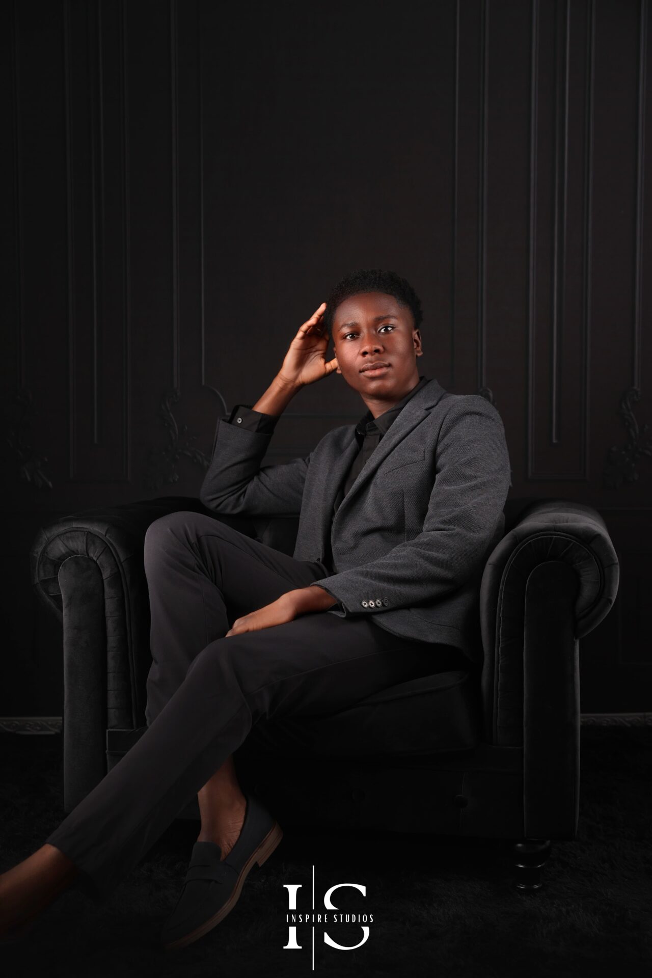 18‑year‑old man in London studio posing under soft octabox light for birthday portrait