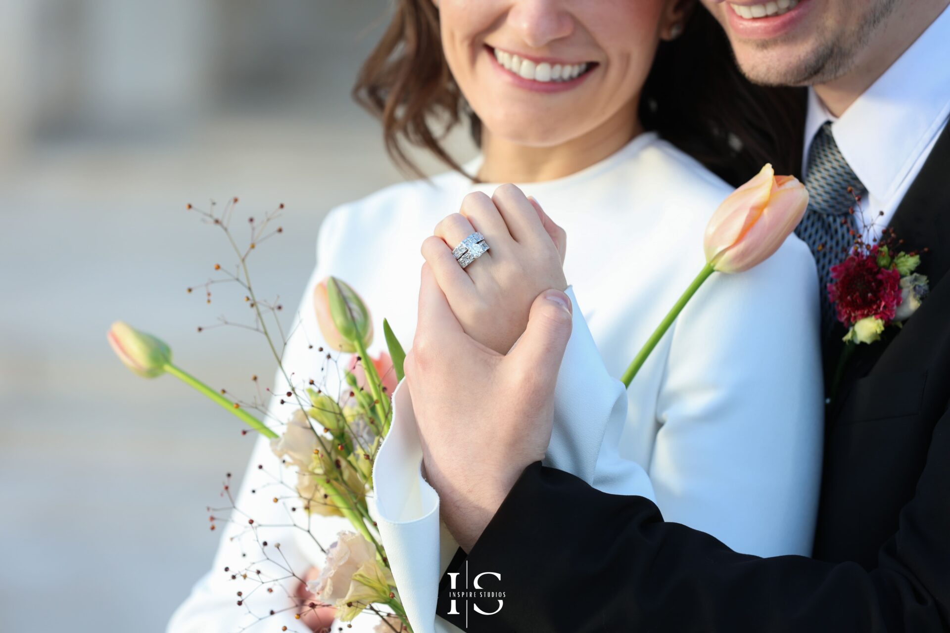 Bride and Groom enjoying the moment watchin the rings after their registry ceremony captured by wedding photographer.