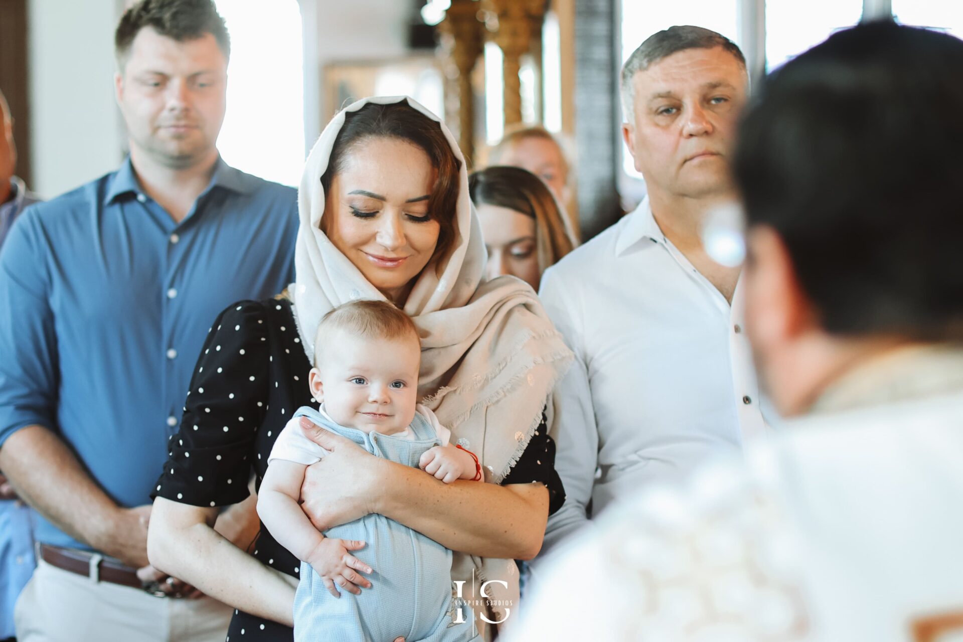 London baby christening ceremony photographed with family and godparents