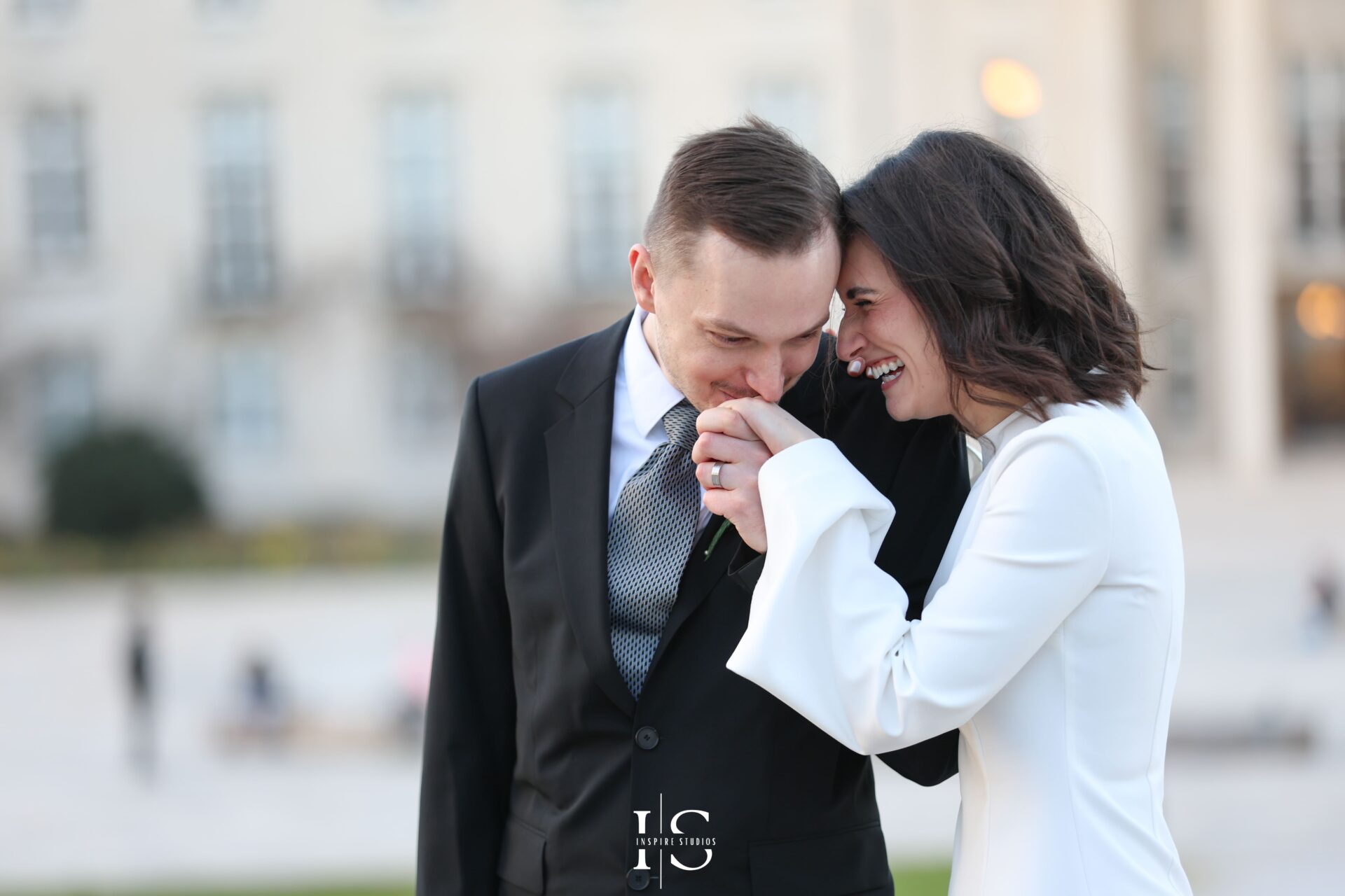 Bride and groom during emotional moment at London registry wedding, female photographer style