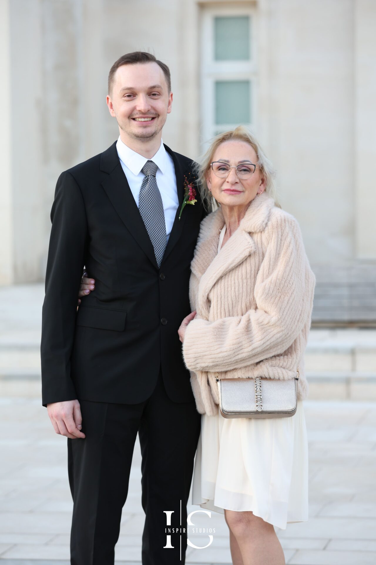 Groom sharing a moment with his mother before wedding