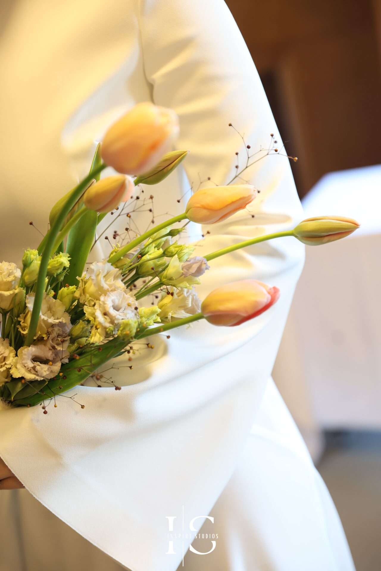 Bride holding her bouquet, smiling softly