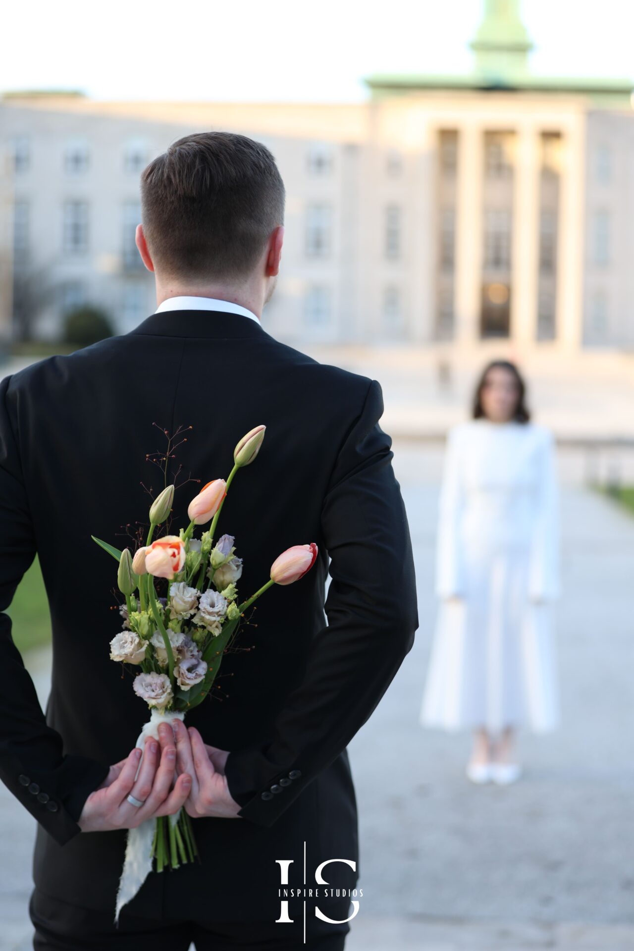Bride and groom walking hand-in-hand after registry wedding