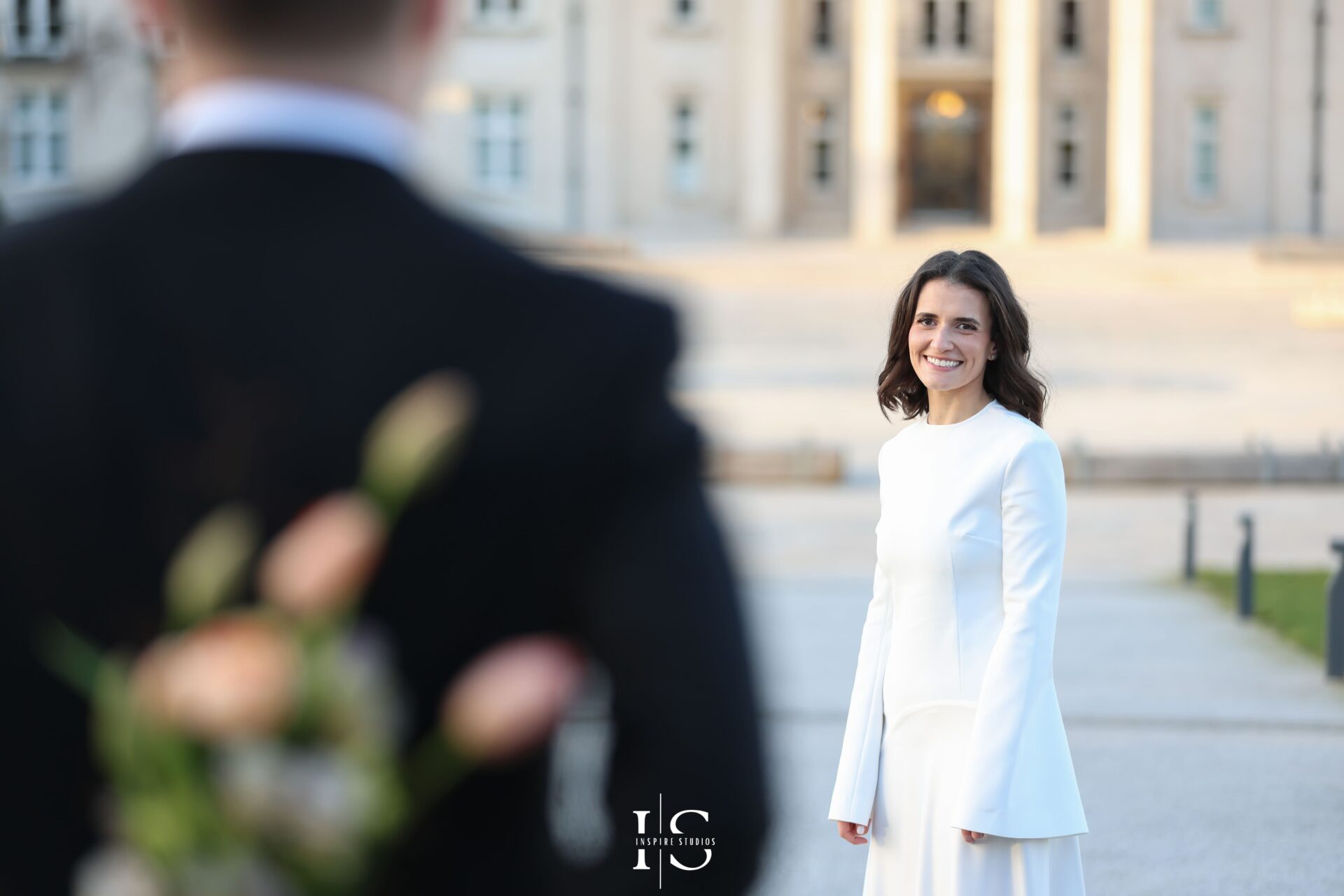 Bride and groom smiling during post-ceremony photoshoot