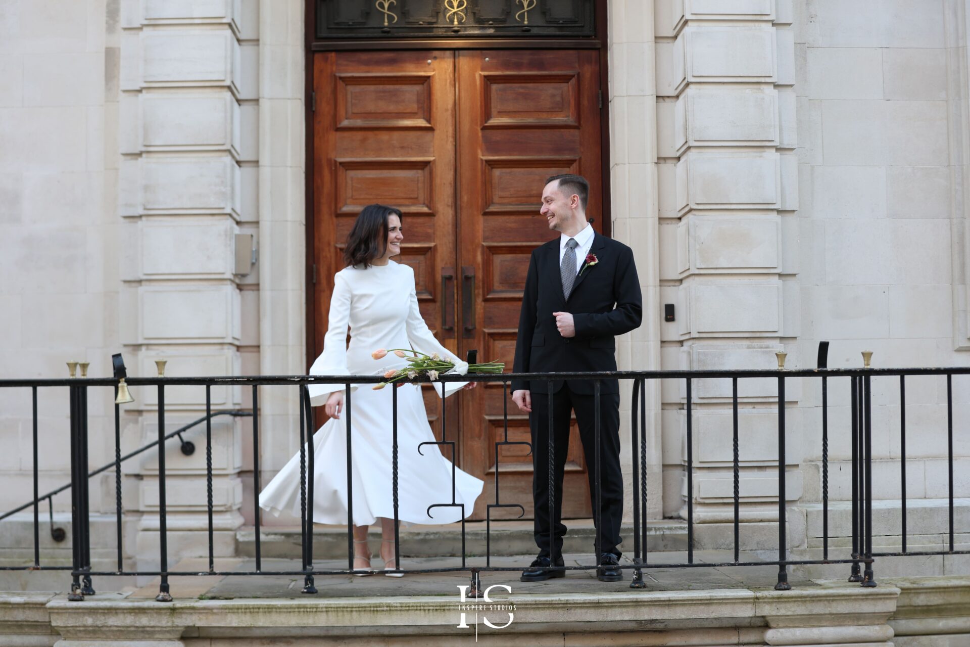 Bride and groom laughing during photoshoot at Walthamstow Town Hall