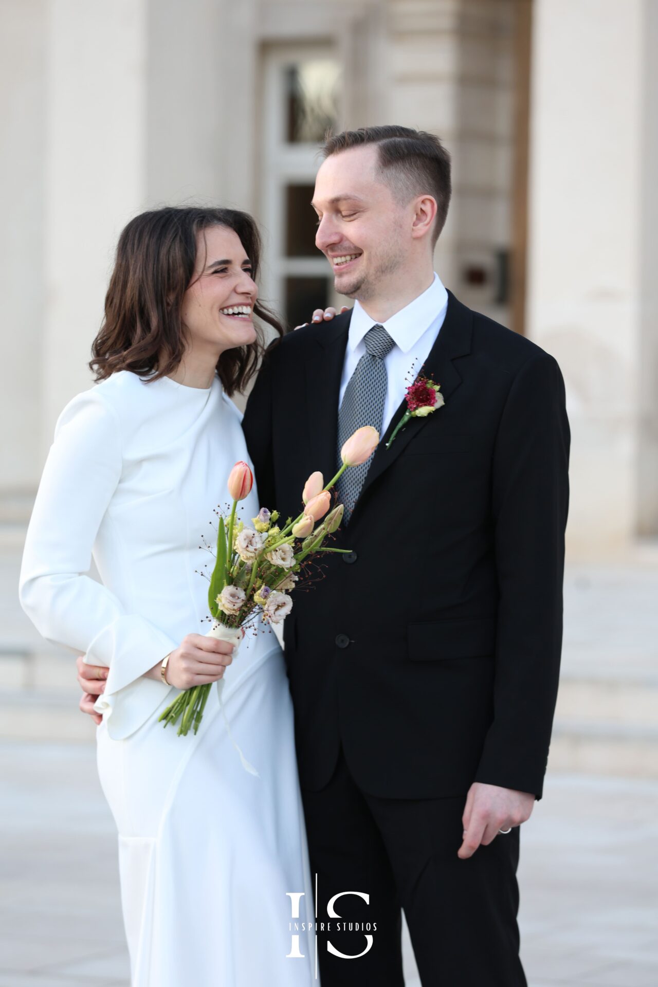 Bride and groom smiling just after being married at Walthamstow registry ceremony
