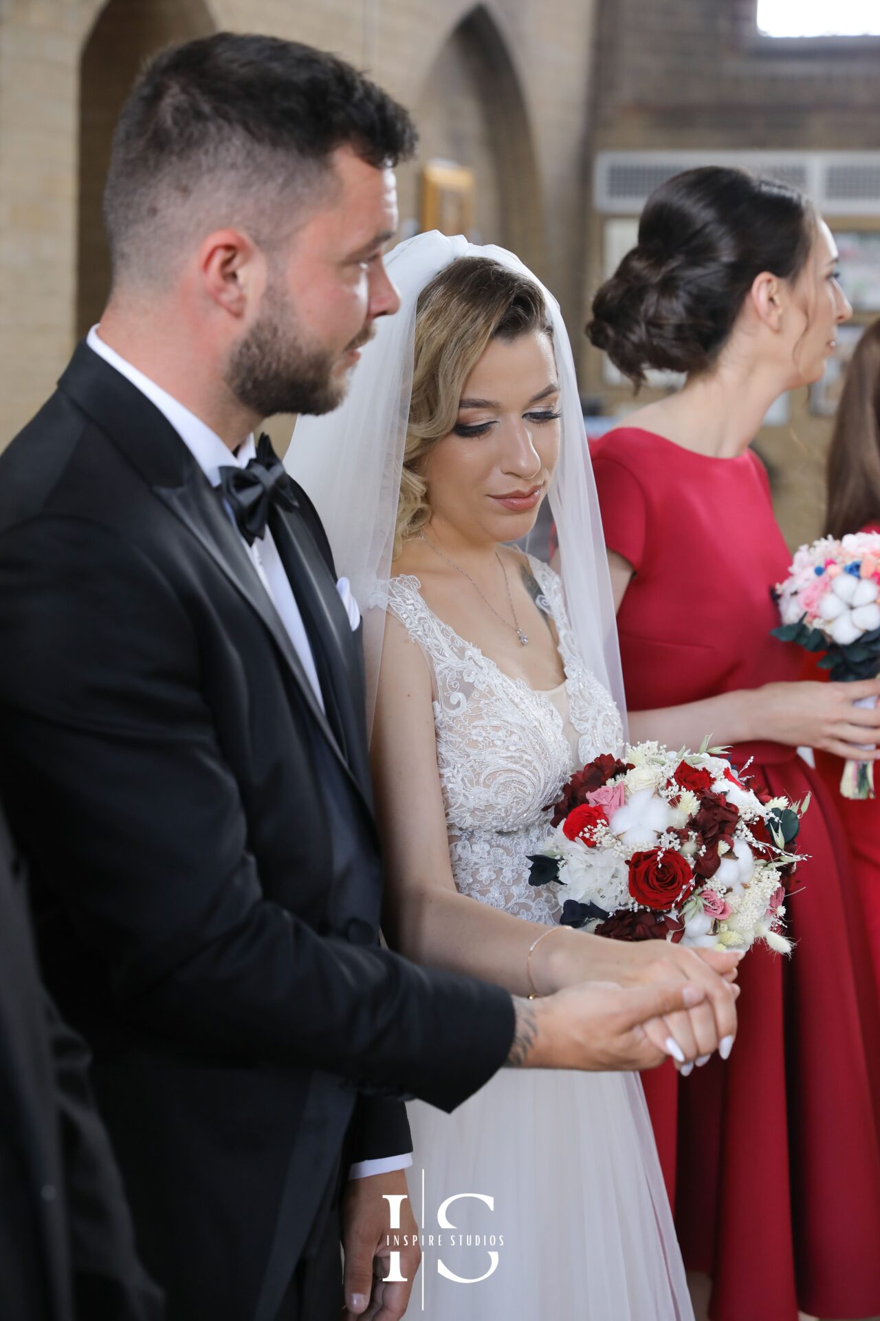 Groom and bride portrait with female photographer
