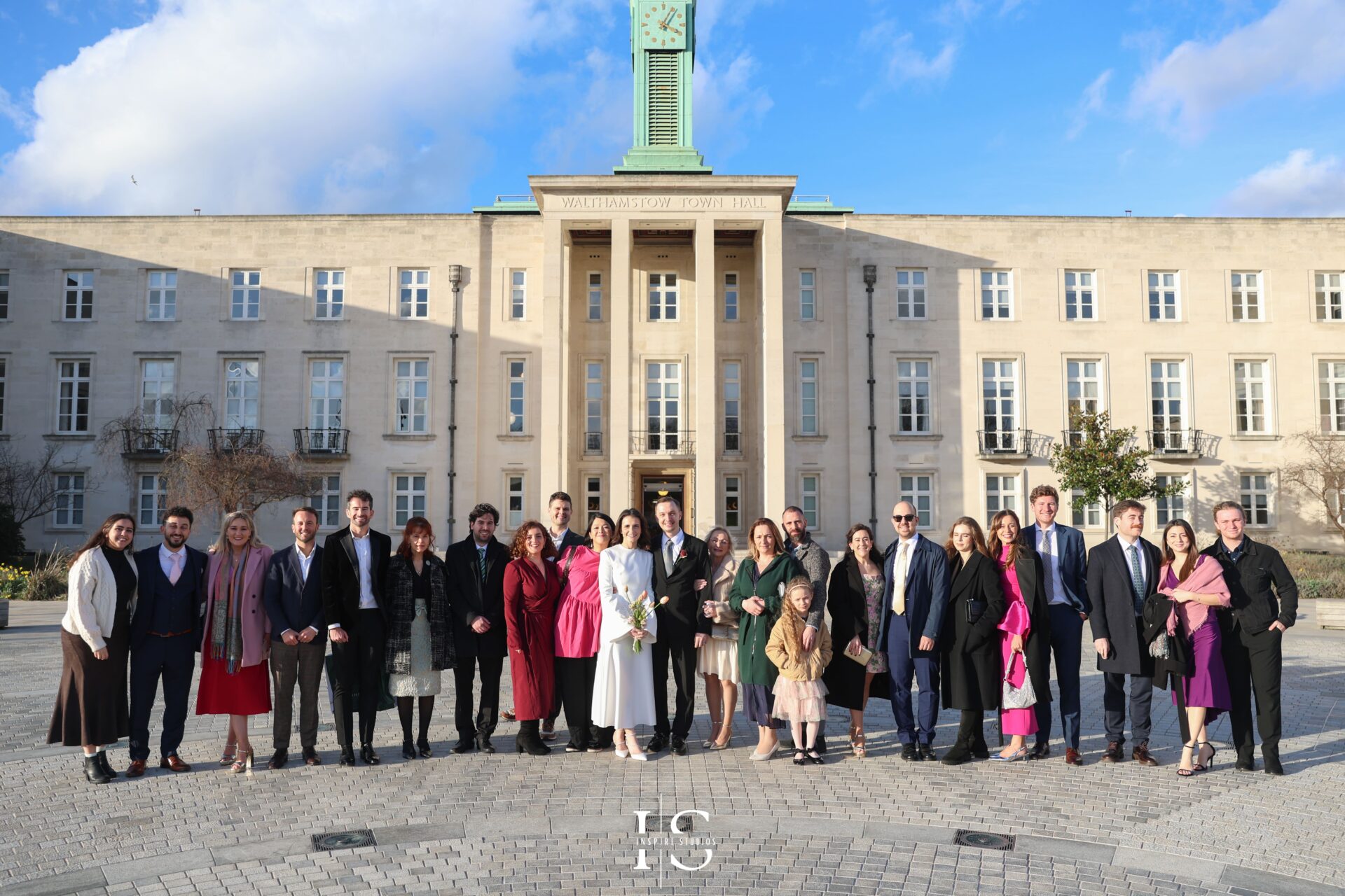 Bride and groom surrounded by guests at Walthamstow Town Hall registry wedding in London