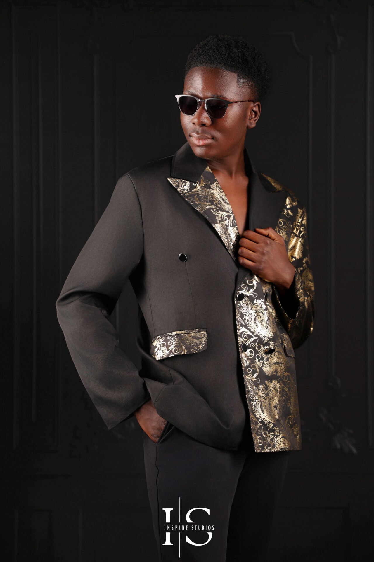 Example pose—man standing with arms crossed, shoulders square during studio shoot