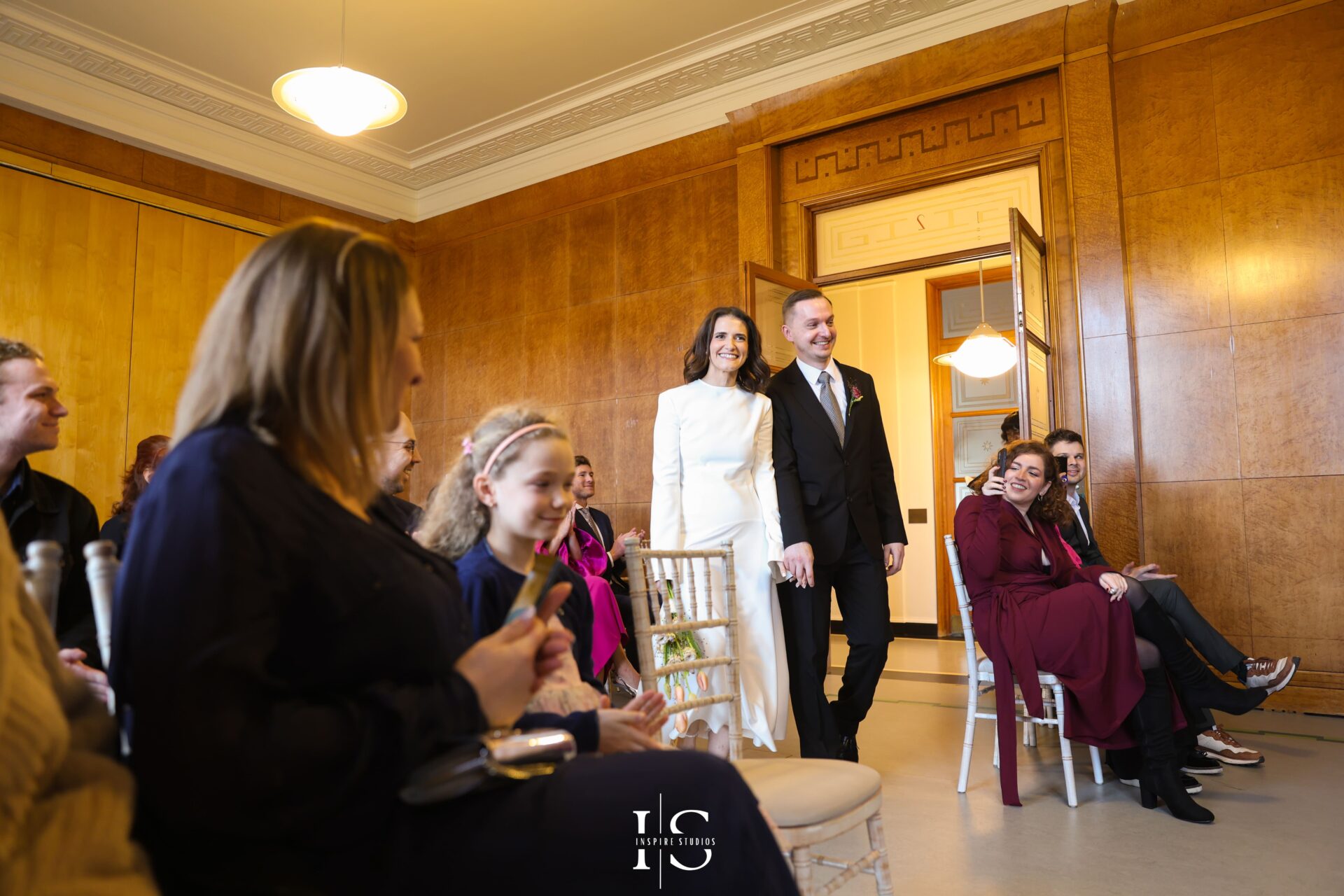 Bride and groom entering registry hall before wedding ceremony