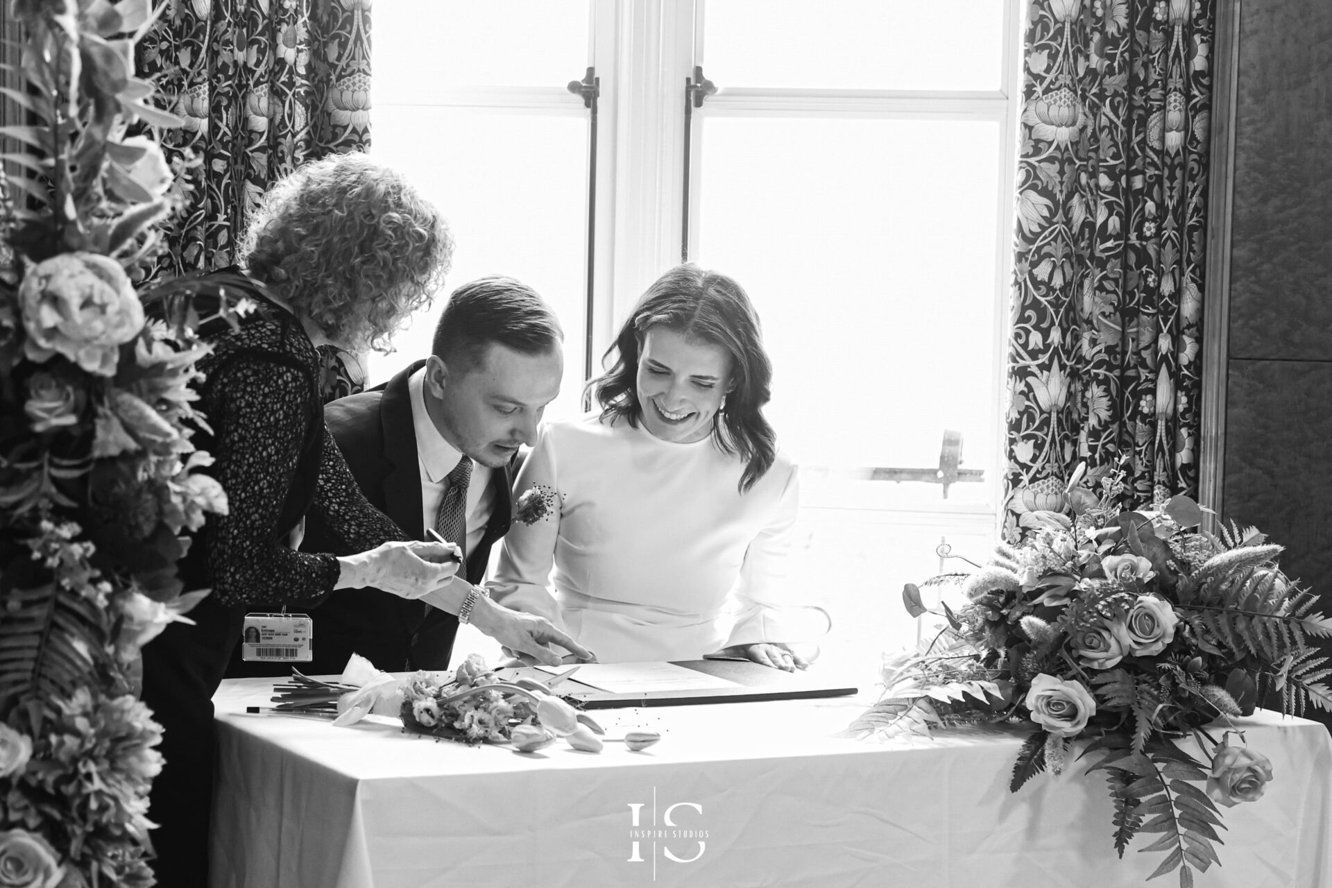 Bride signing registry documents at Walthamstow Town Hall