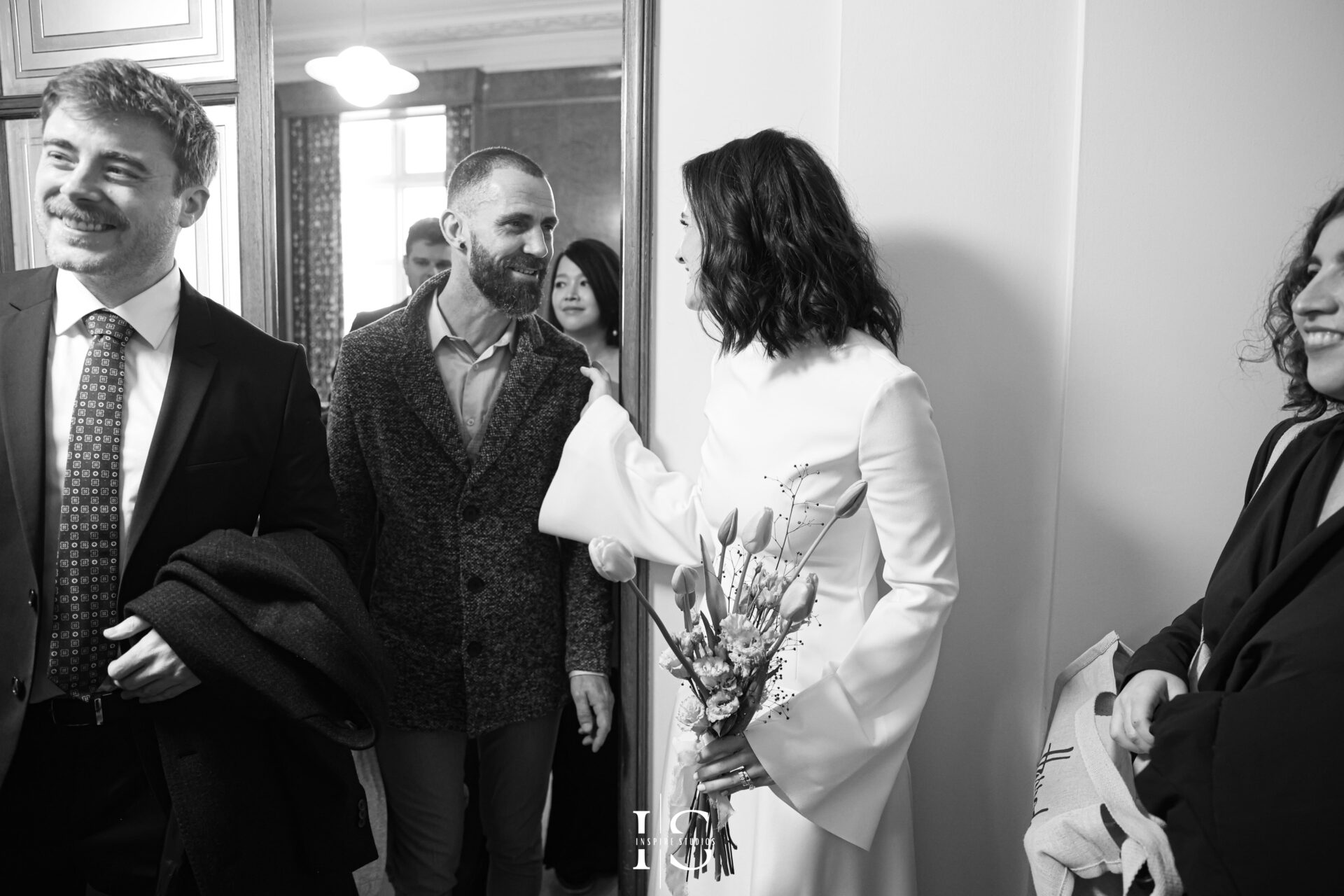 Guests chatting and smiling before London registry ceremony