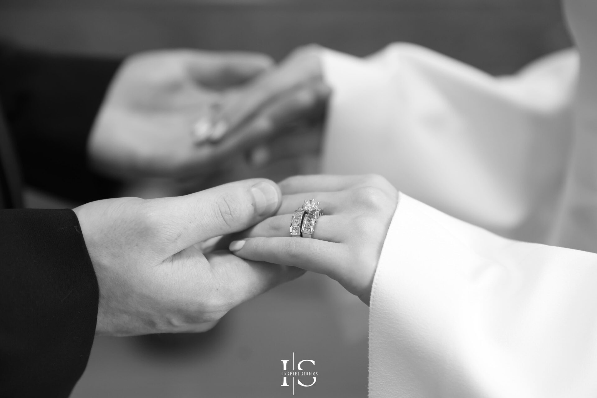 Close-up of couple exchanging rings during registry wedding ceremony
