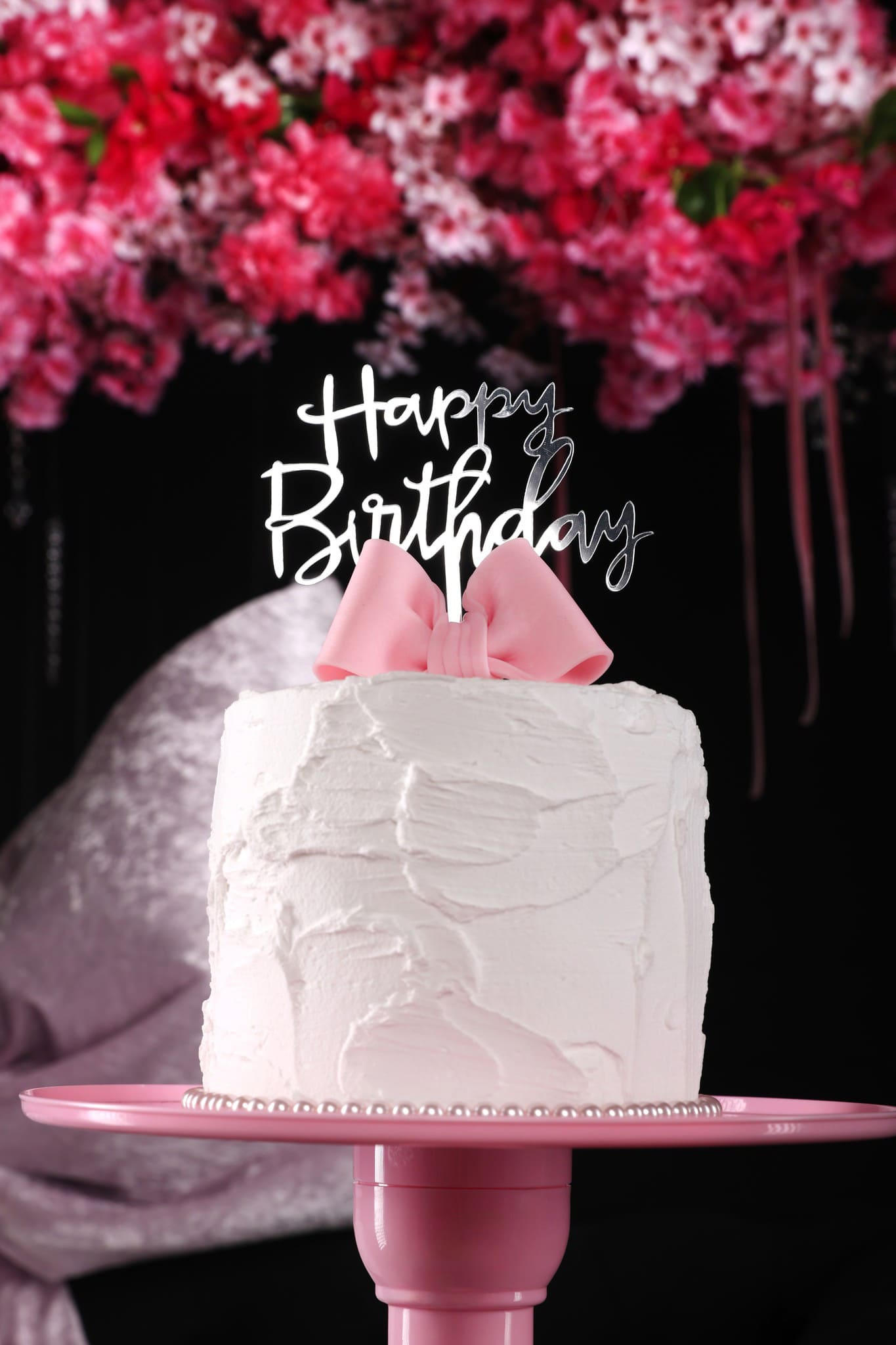 Elegant dummy birthday cake with modern adult-themed decoration