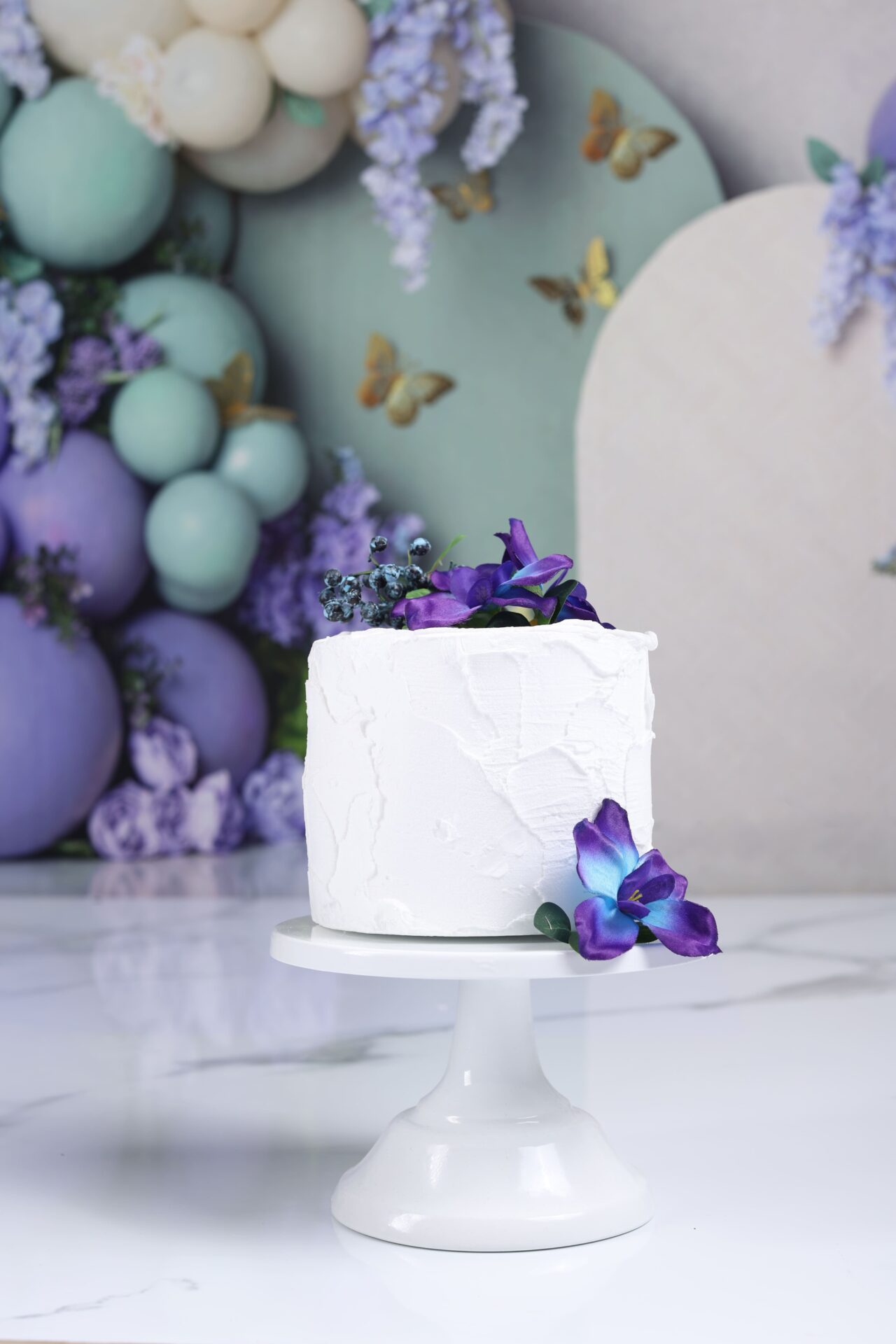 Themed dummy birthday cake with pastel colors for child photoshoot