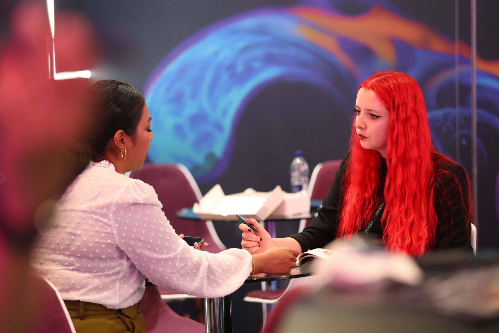 Close-up corporate event photography in London capturing speaker and audience interaction