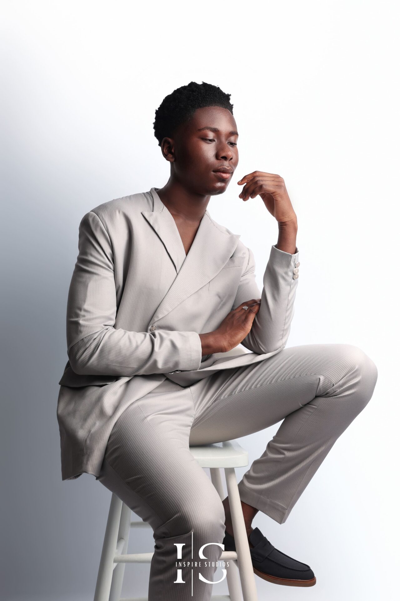 Editorial full‑length men’s birthday portrait shot in Walthamstow photography studio
