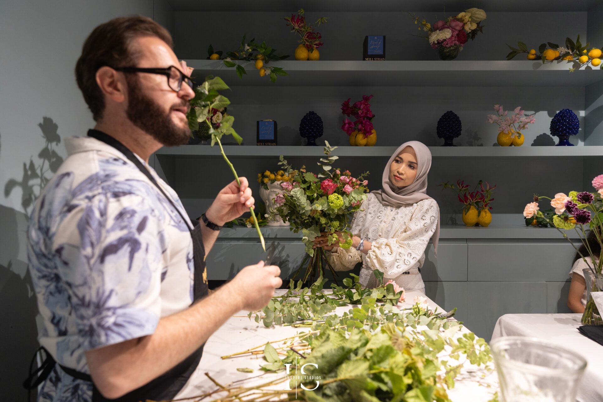 Photographer capturing floral masterclass moments at Neill Strain Floral Couture Mayfair.