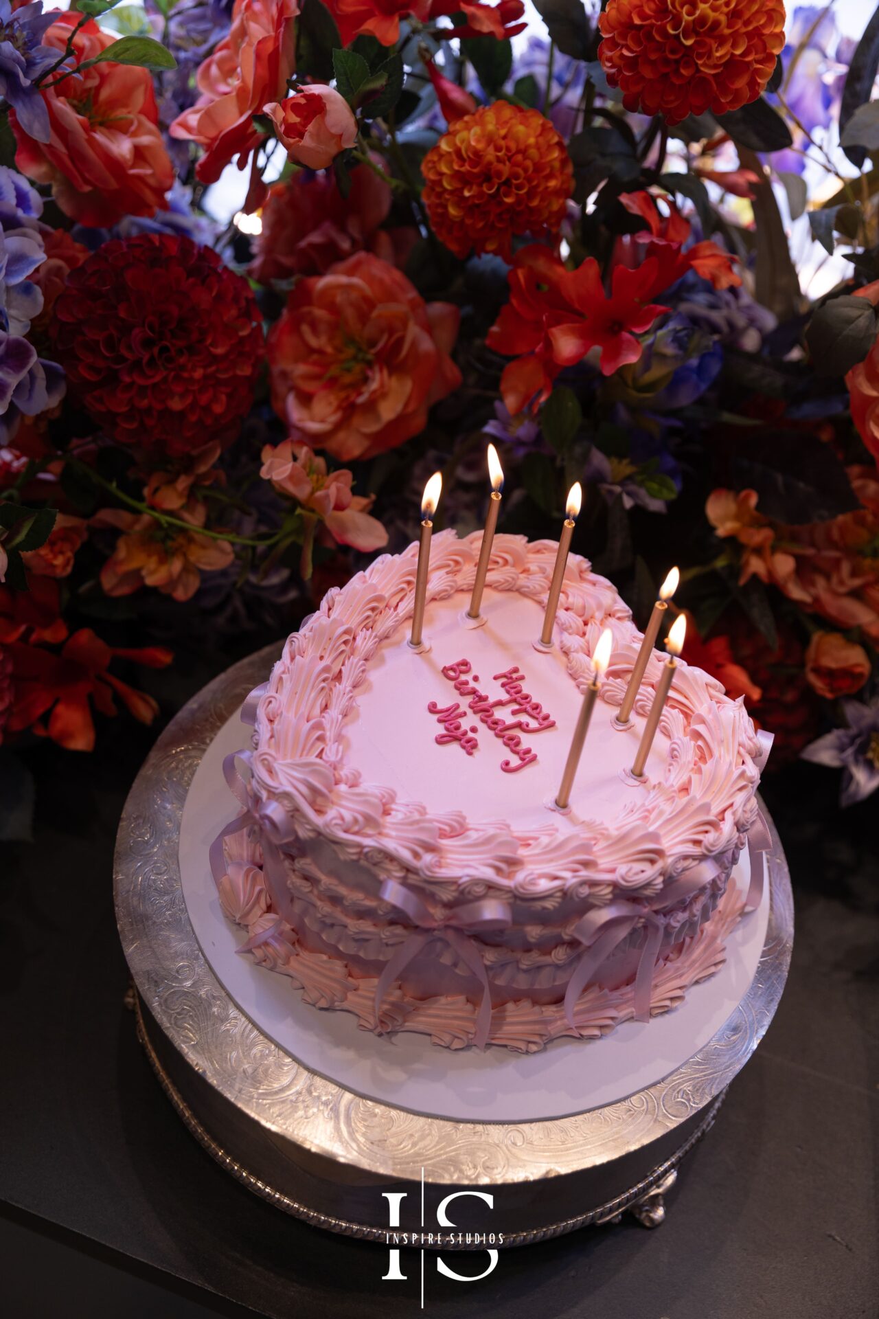 Luxury birthday cake styled with florals at Neill Strain Mayfair event.