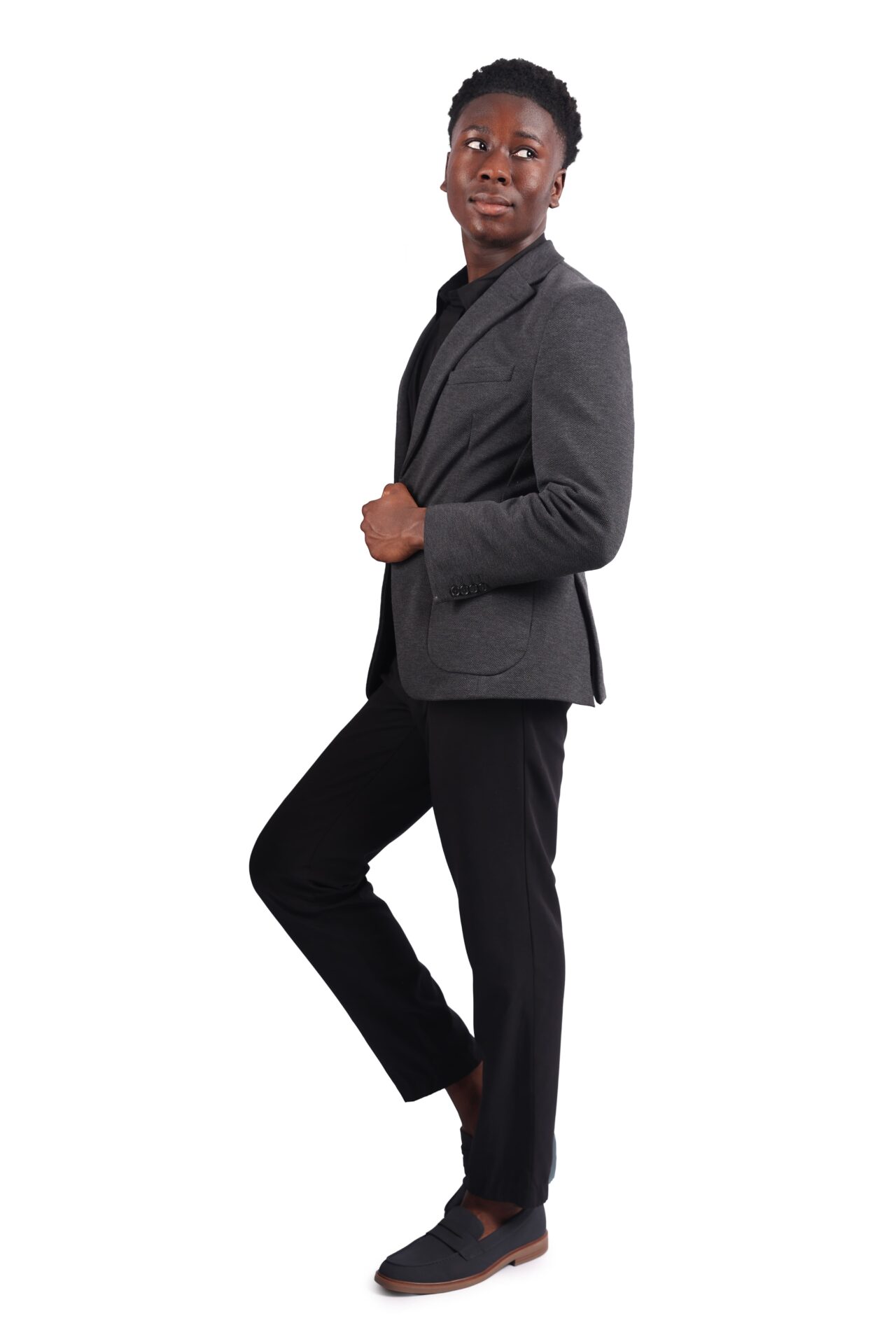 Minimalist studio backdrop featuring young man standing confidently for birthday photo