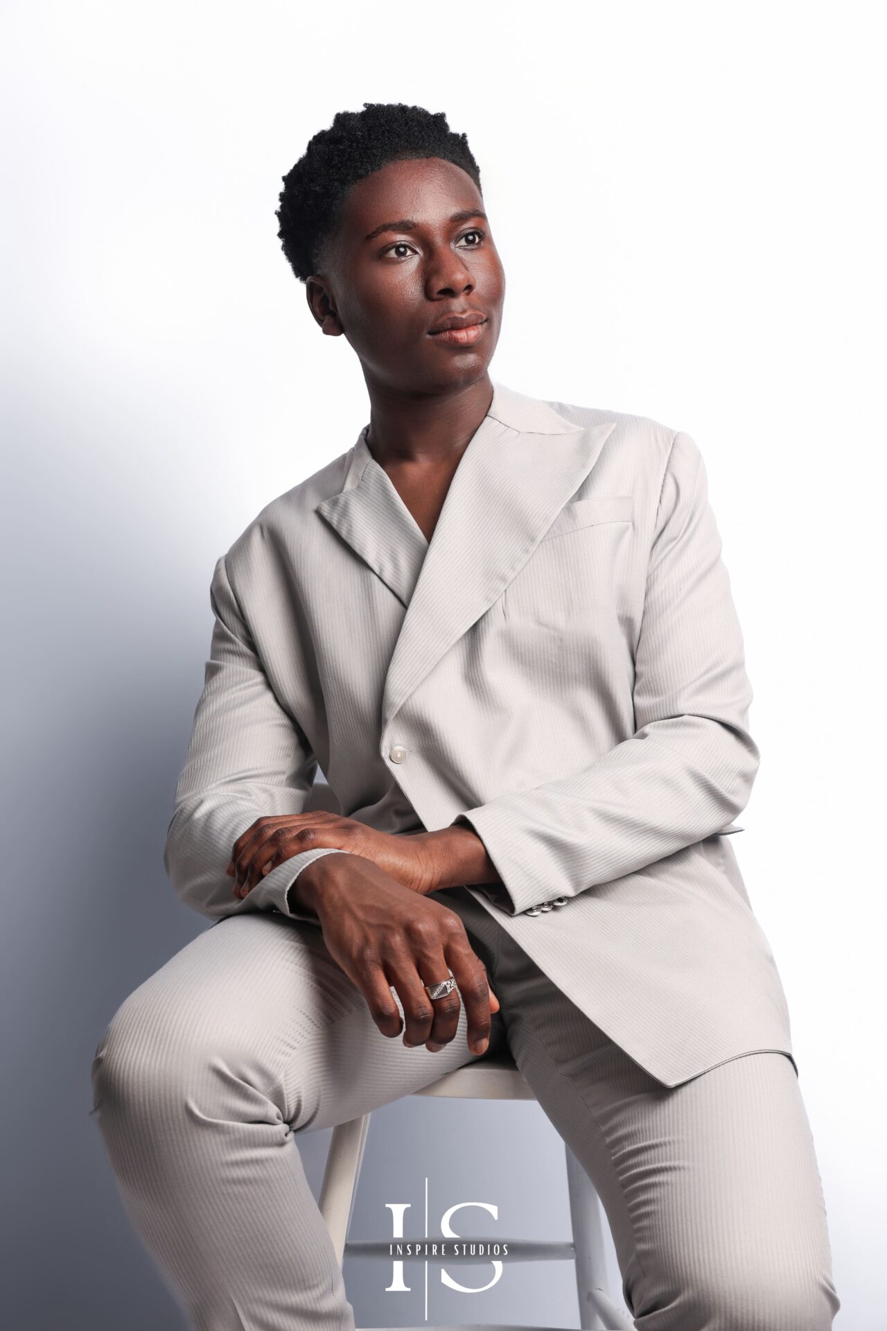 Tight‑crop headshot of young man, soft diffused studio light highlighting eyes