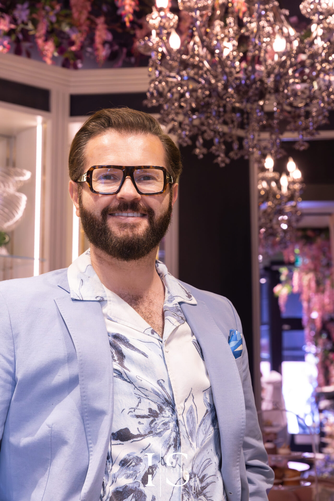 Elegant portrait of floral designer Neill Strain in his Mayfair boutique.