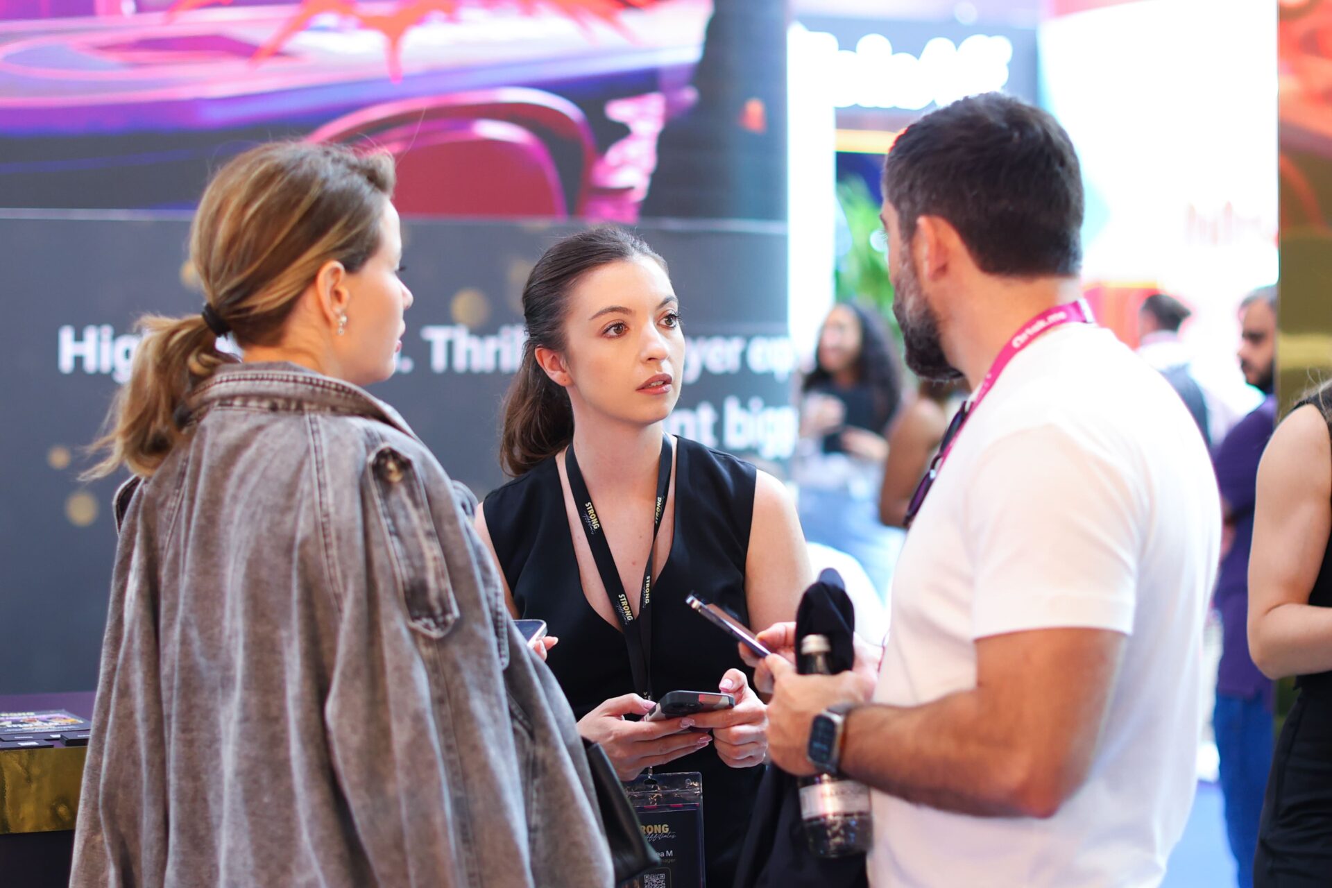 Professional photographer capturing exhibition stand images at IGB Excel London 2025