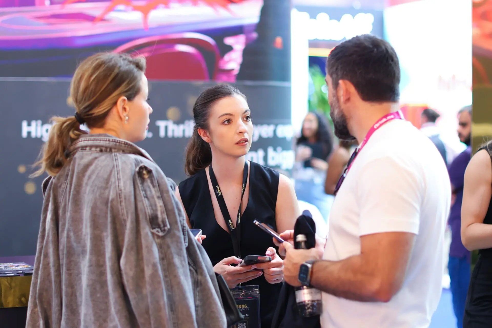 Professional photographer capturing exhibition stand images at IGB Excel London 2025