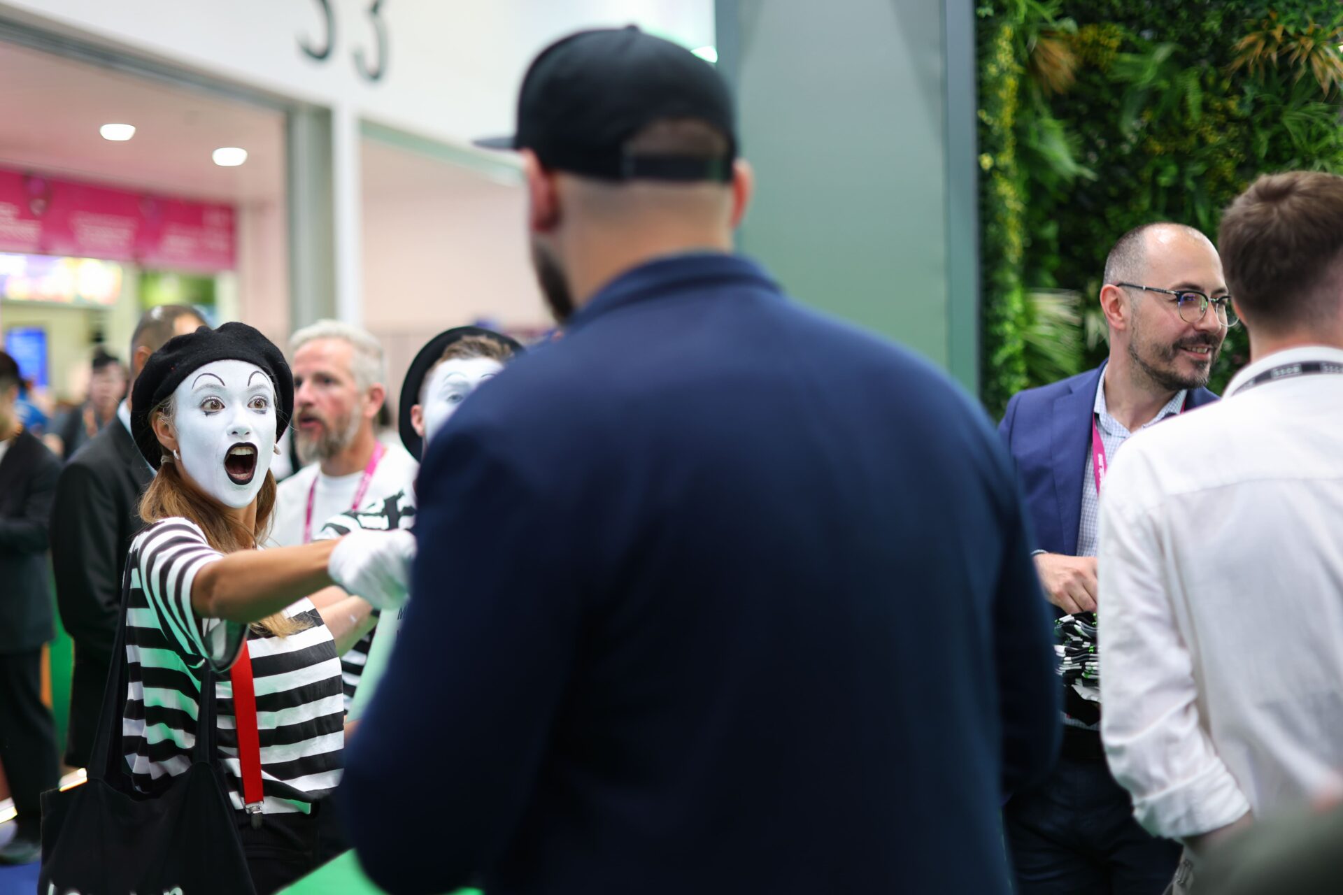Professional photographer capturing corporate event at IGB Excel London