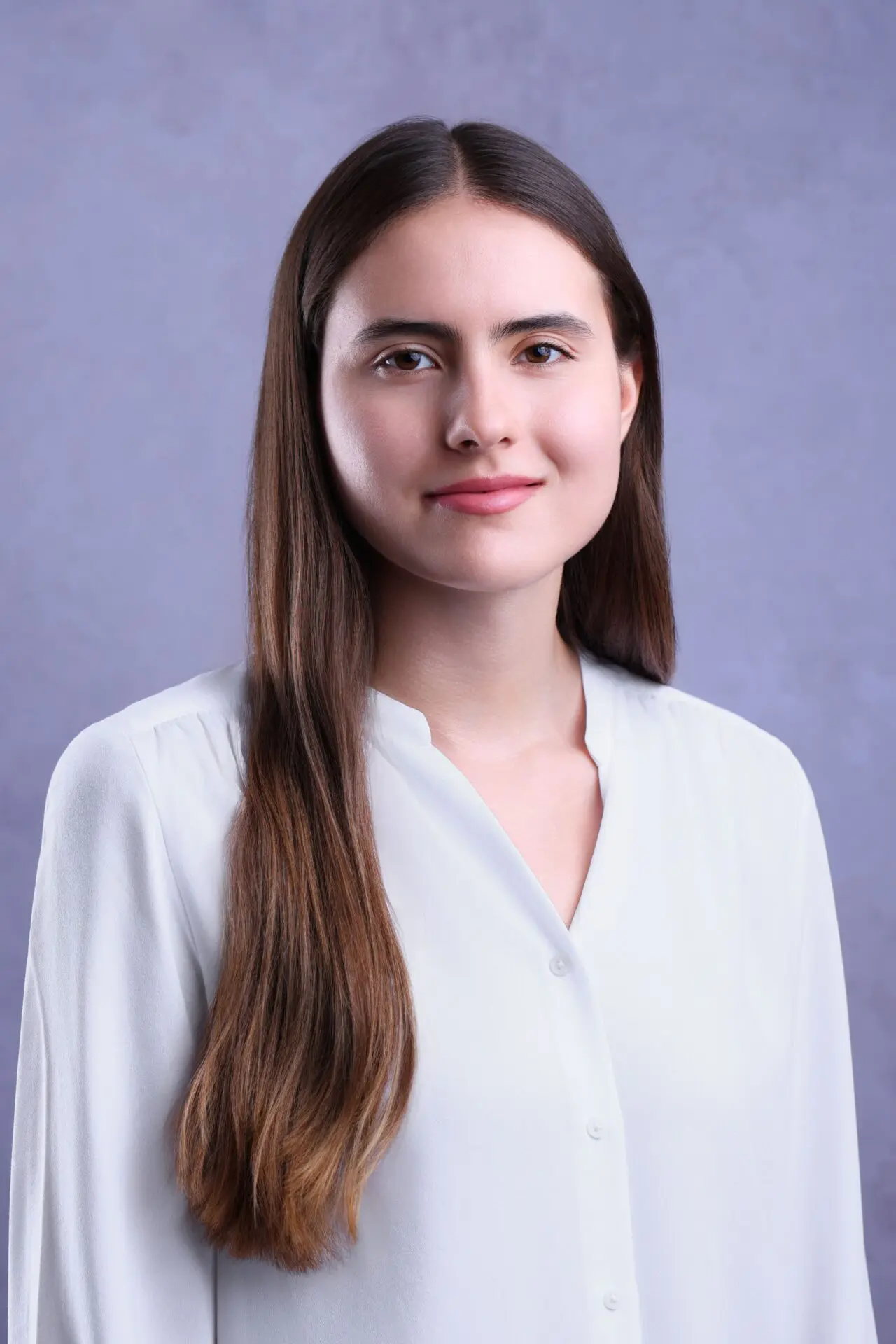 Professional student headshot photo for CV and LinkedIn profile, showing confident young adult with clean background