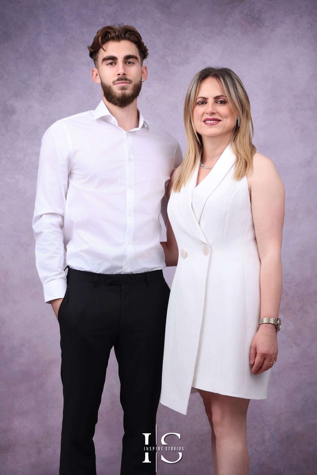 Relaxed Albanian family posing together during a London studio session