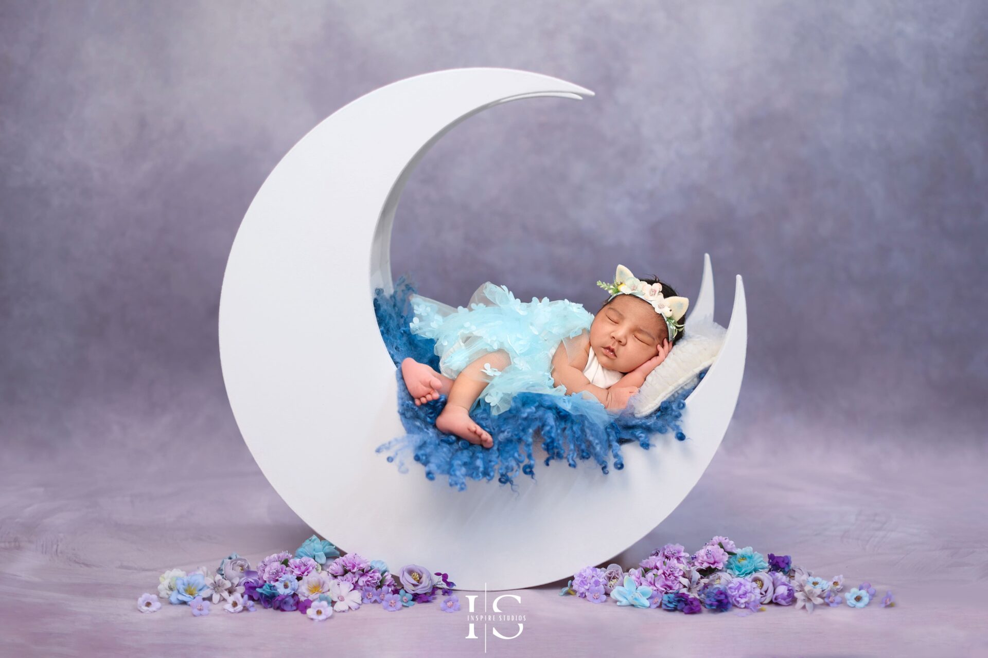 Baby girl sleeping peacefully during her newborn studio session.