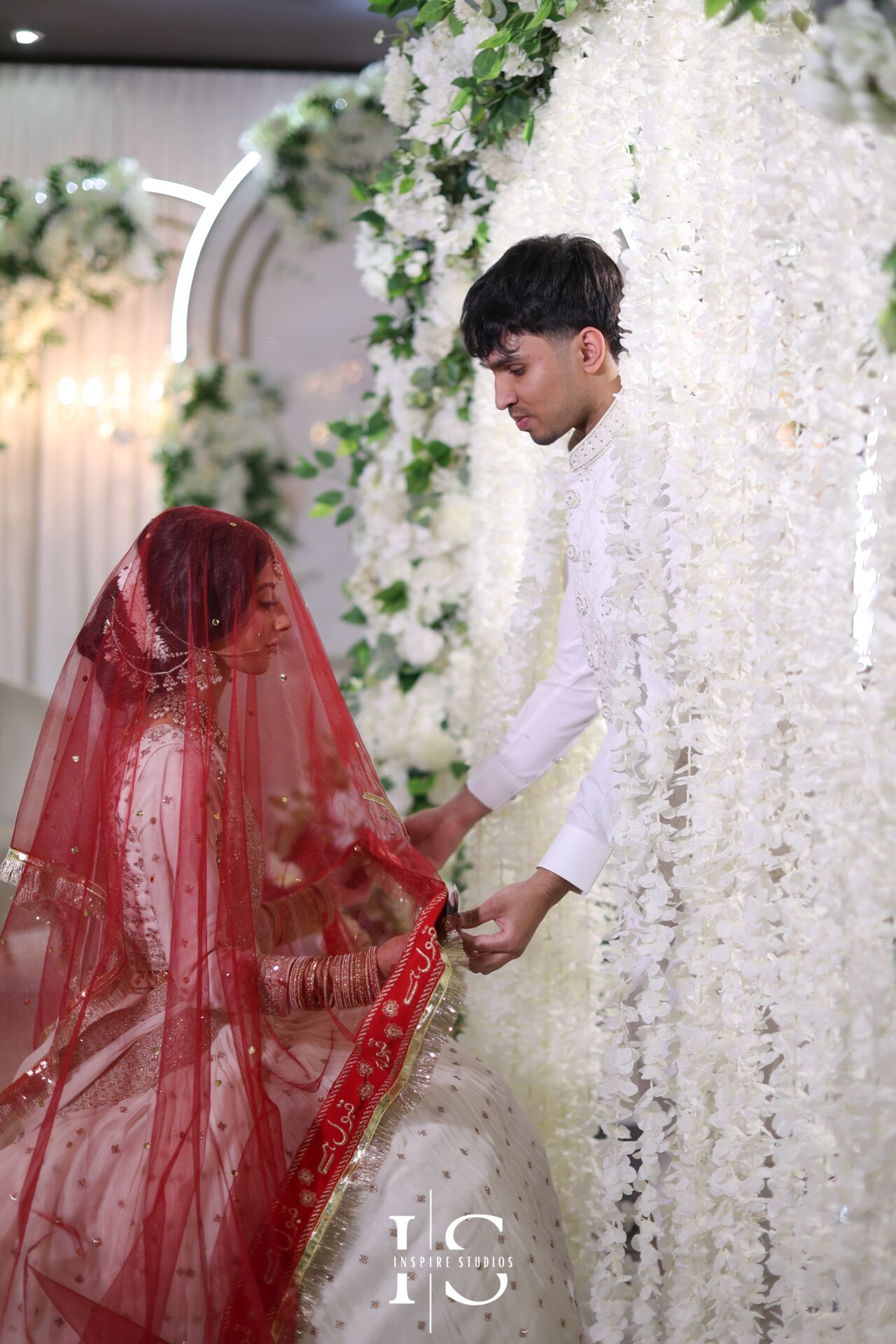 Groom lifts bride’s veil during intimate Nikkah moment in London