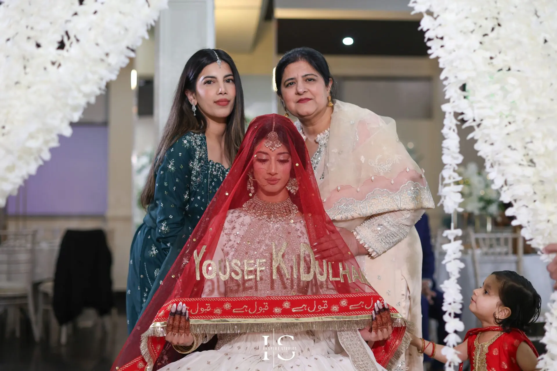 Bride with family at Nikkah – London female wedding photographer